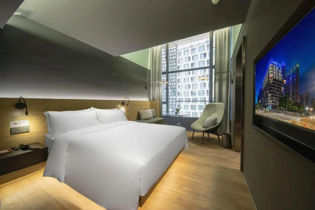 Bed in Opus Hotel Jiangmen