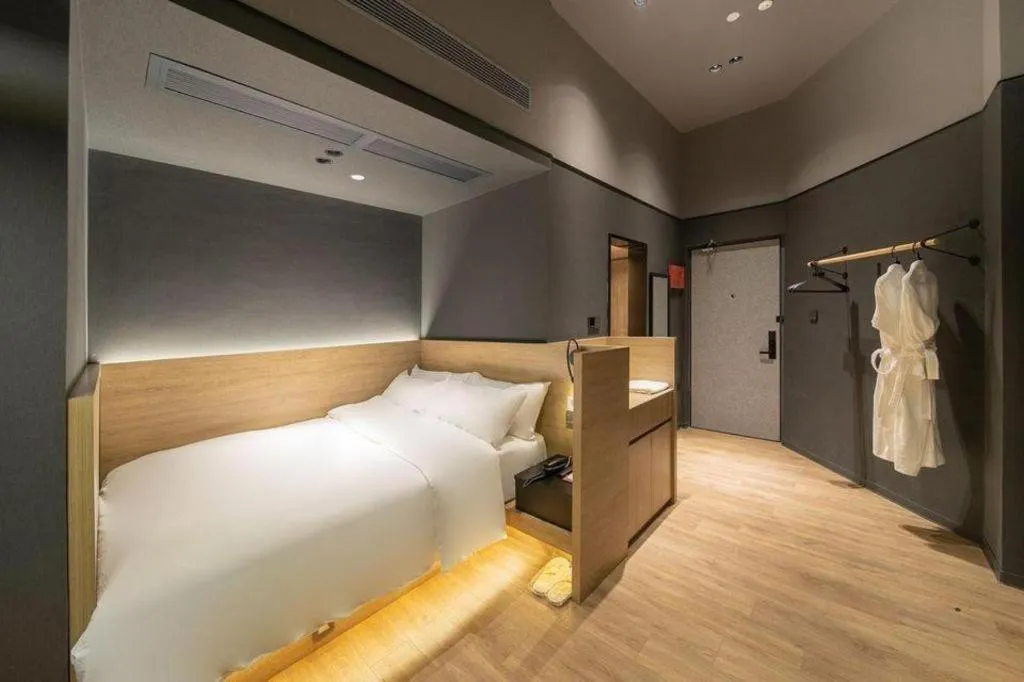 Bed in Opus Hotel Jiangmen