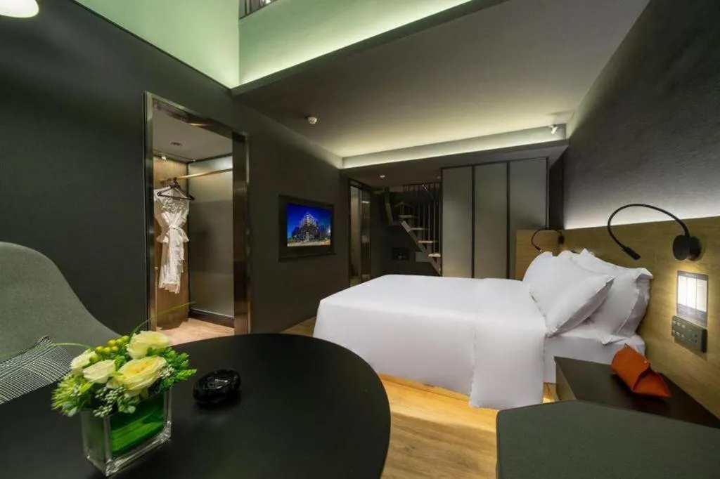 Bed in Opus Hotel Jiangmen