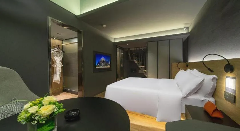 Bed in Opus Hotel Jiangmen