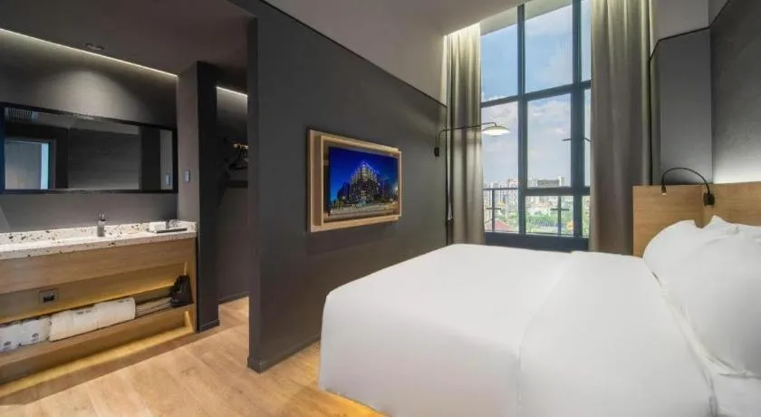 Bed in Opus Hotel Jiangmen