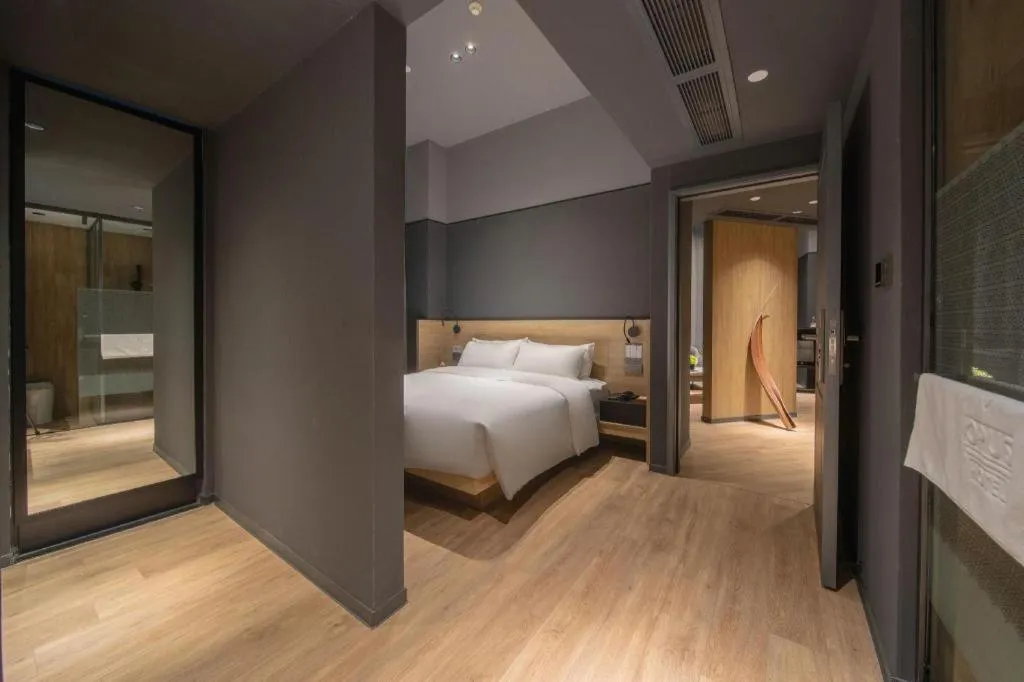 Bed in Opus Hotel Jiangmen
