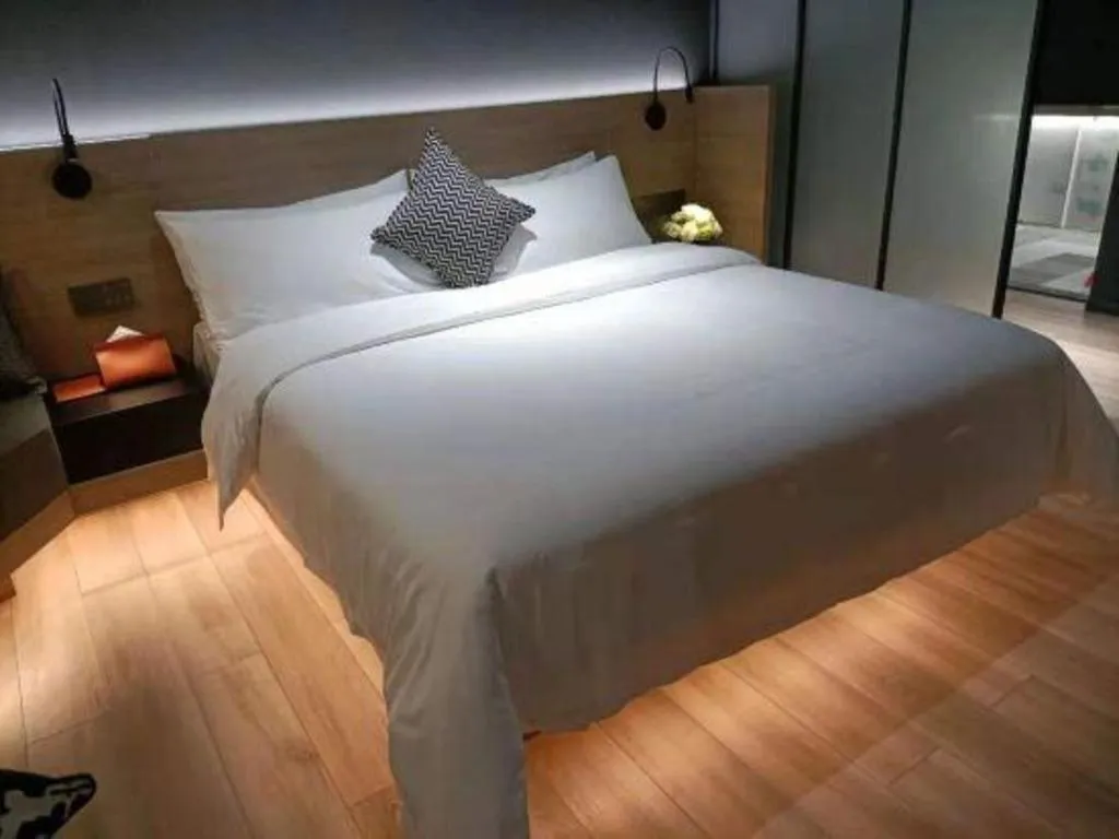 Bed in Opus Hotel Jiangmen
