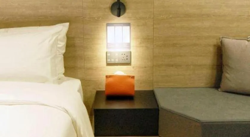 Bed in Opus Hotel Jiangmen