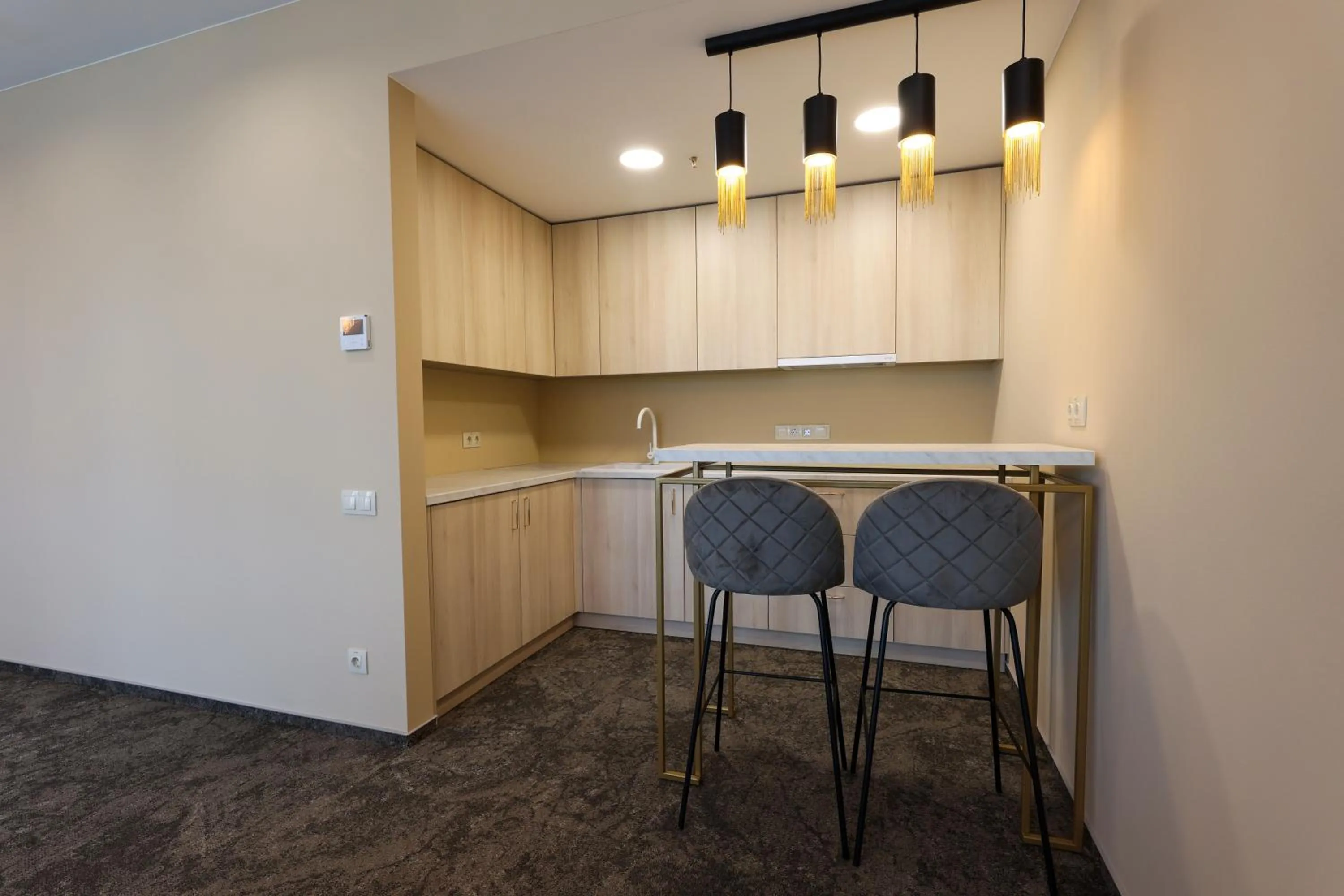 Kitchen or kitchenette in Suncity Hotel & SPA