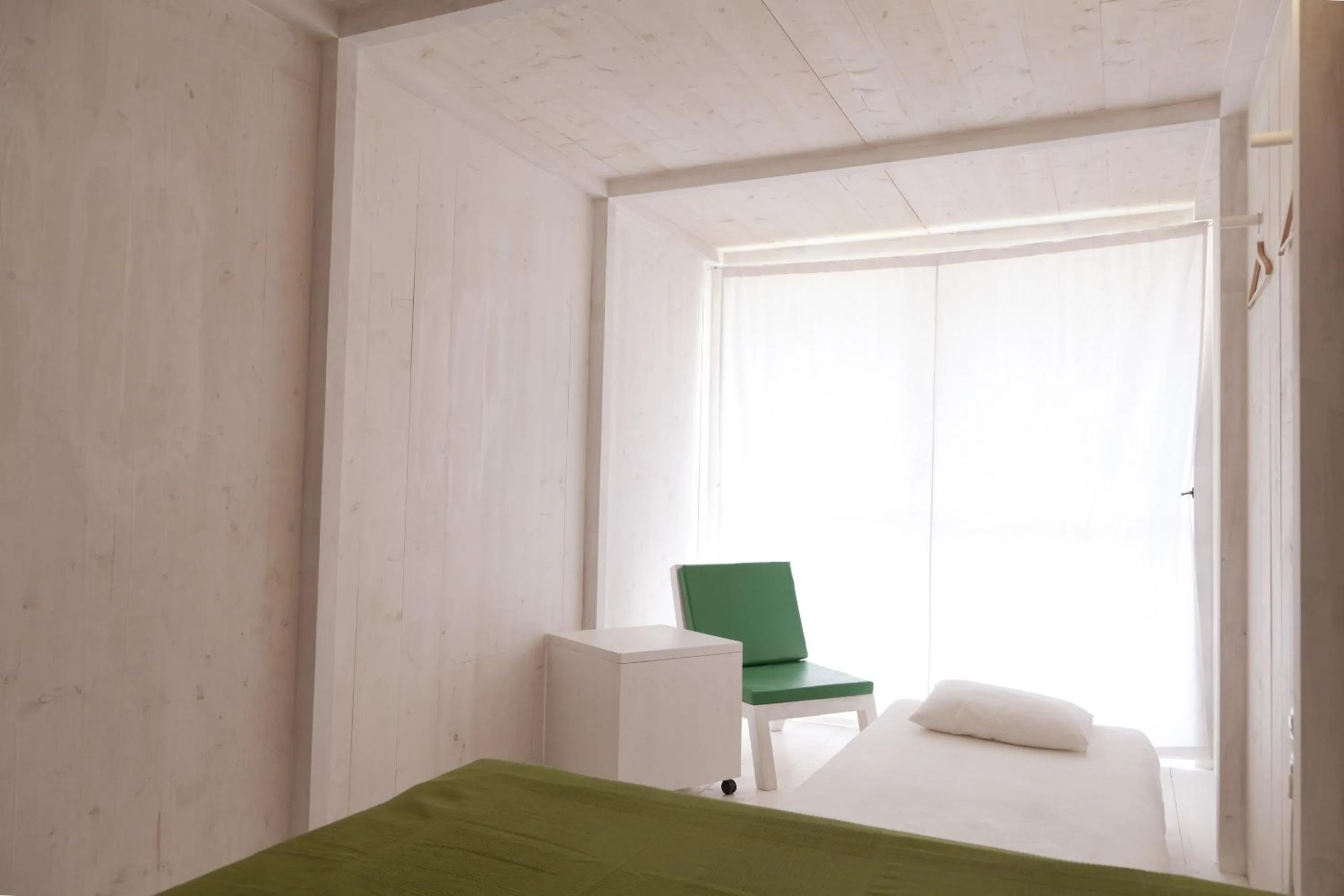 Decorative detail, Bed in Aquiles Eco Hotel