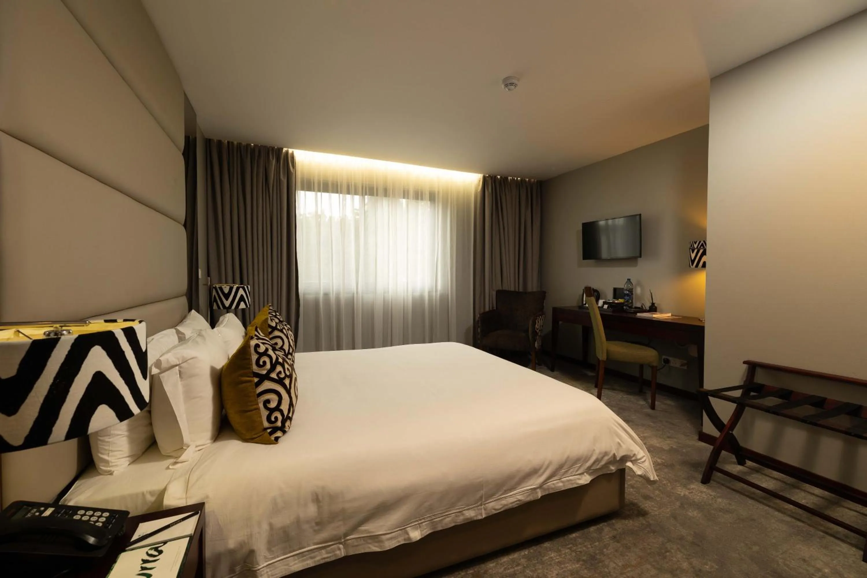 Bed in Fiesta Residences Boutique Hotel and Serviced Apartments.