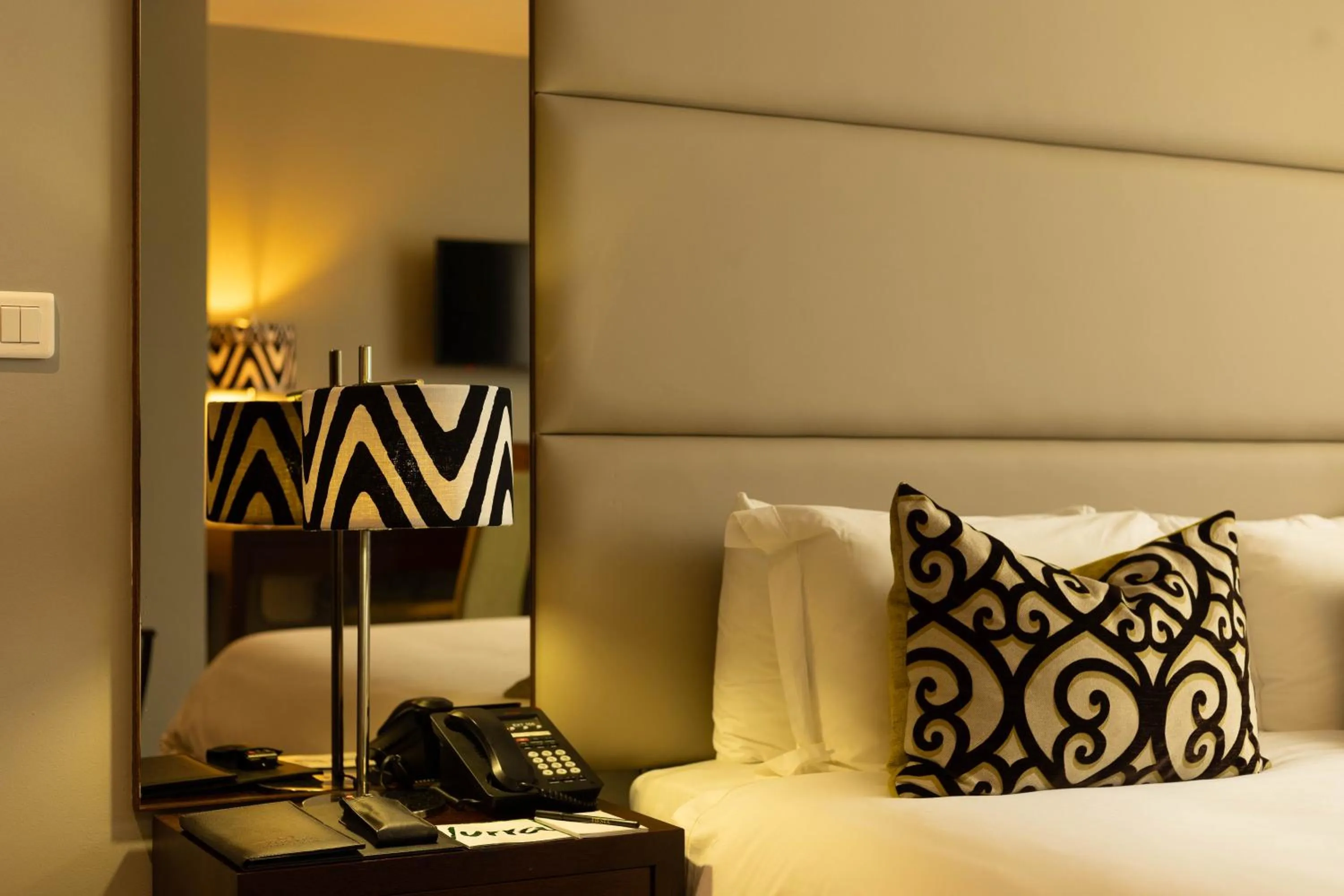 Bed in Fiesta Residences Boutique Hotel and Serviced Apartments.