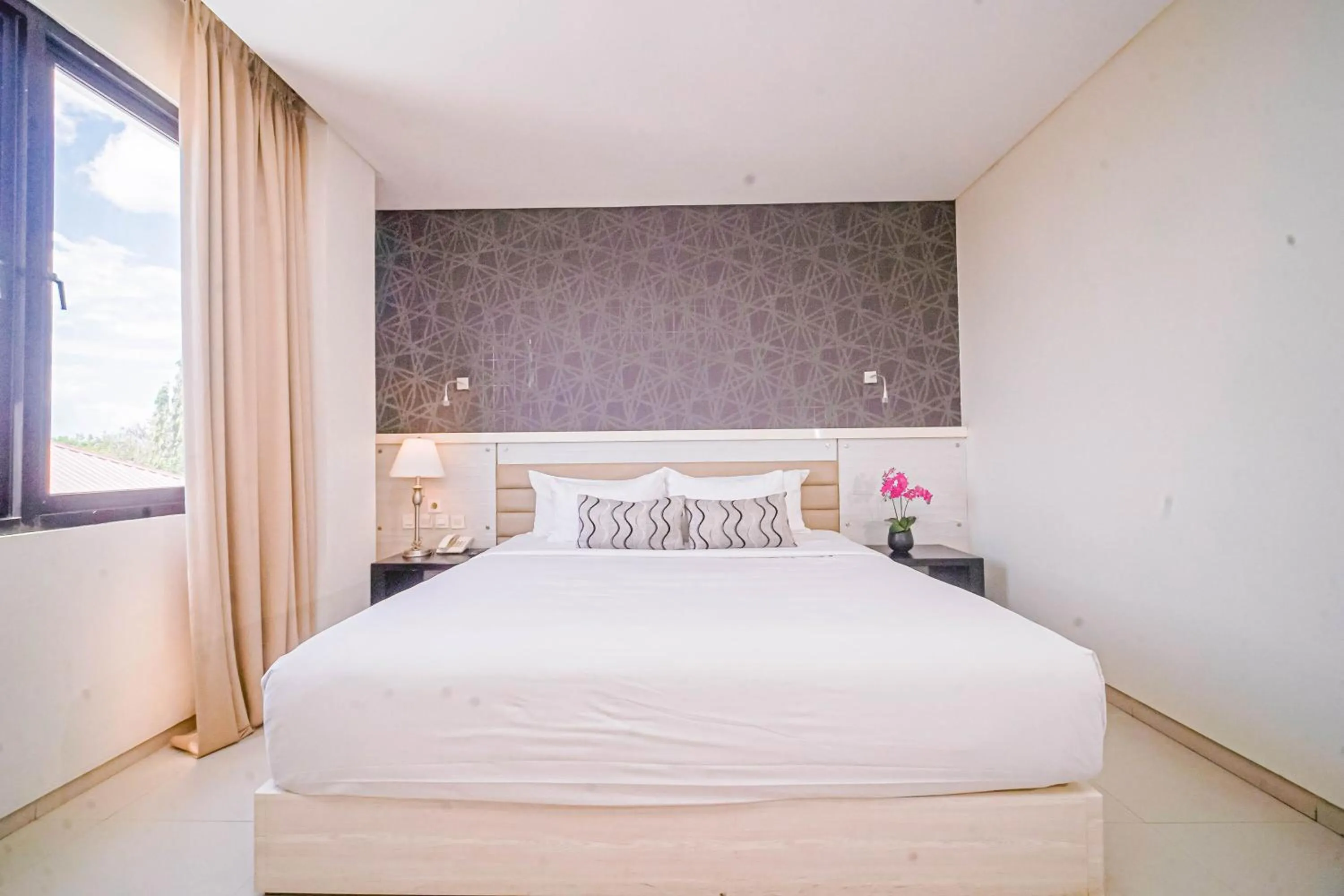 Bed in Sahid T-More Hotel