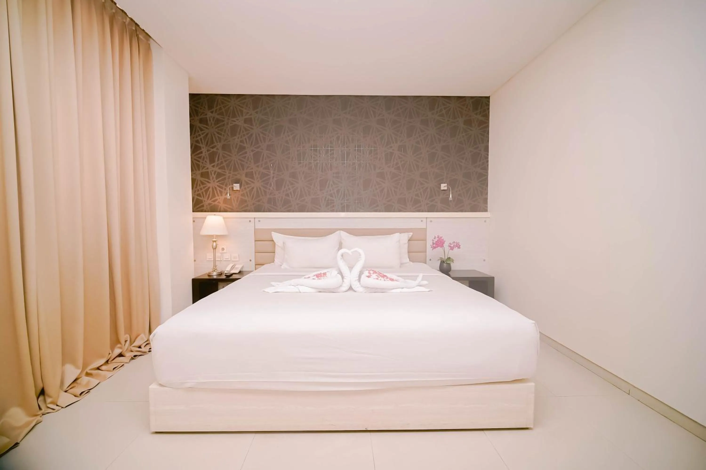 Bed in Sahid T-More Hotel