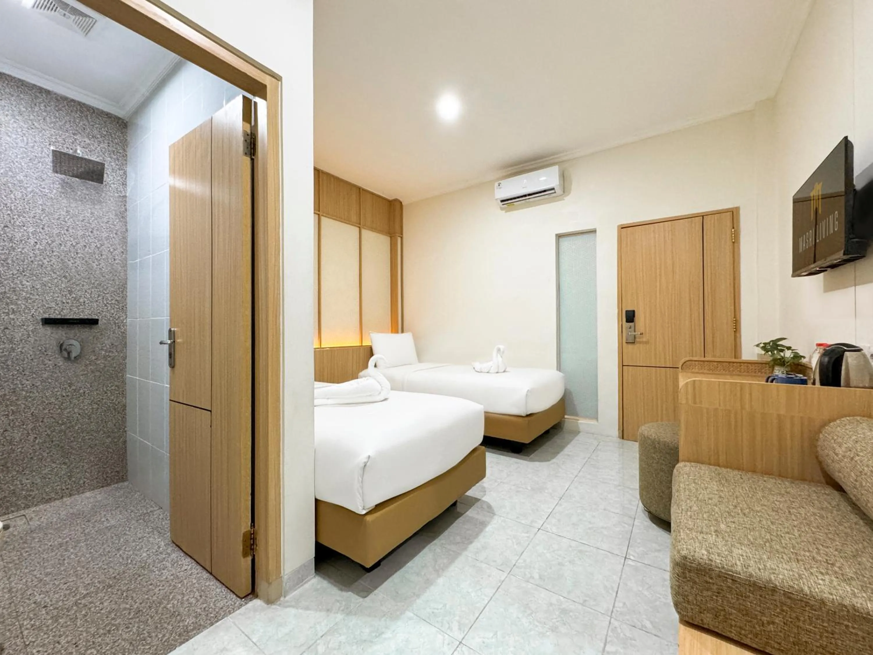 Bed in Masri Living by Daphna Management