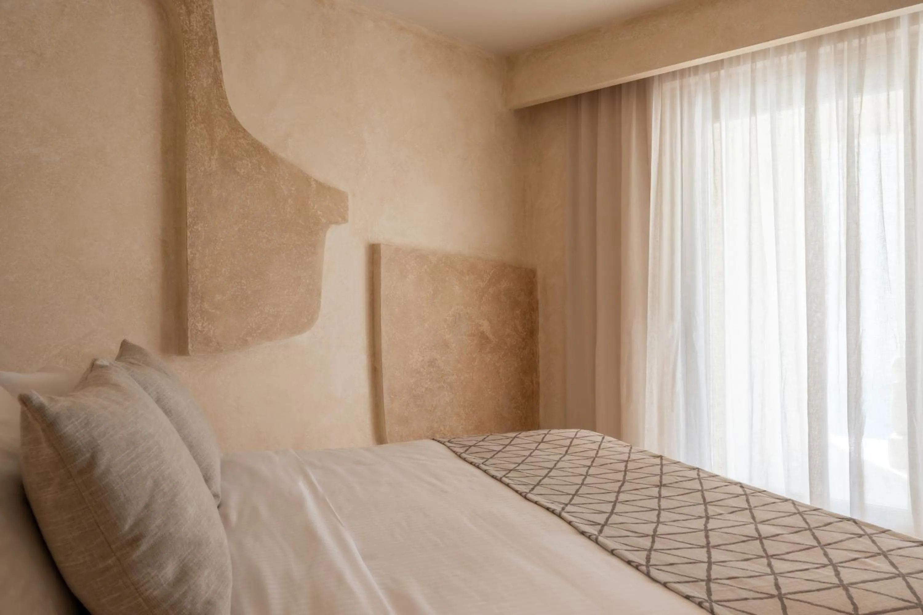 Bed in Heyday Luxury Suites