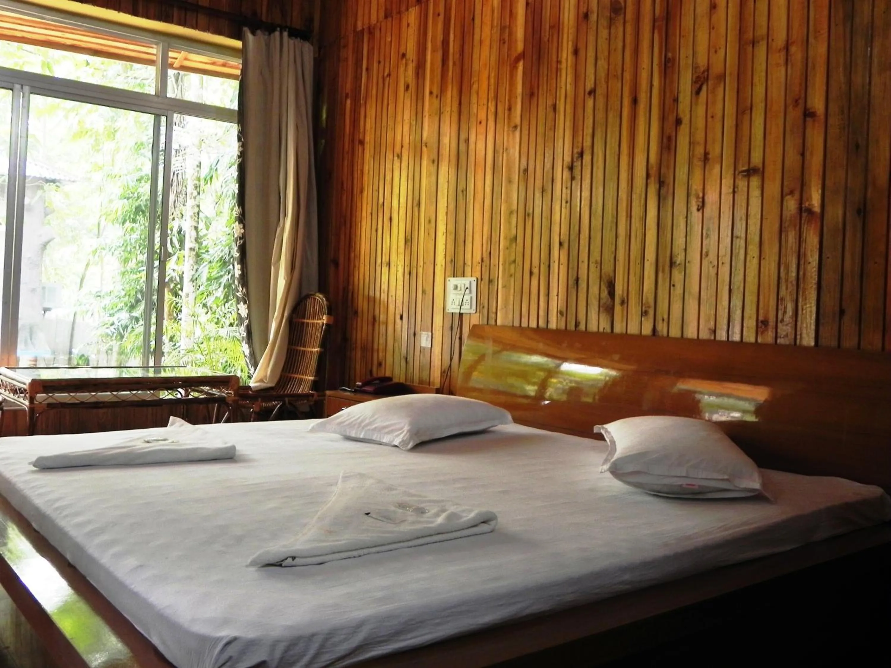 Bed in Aranya Jungle Resorts