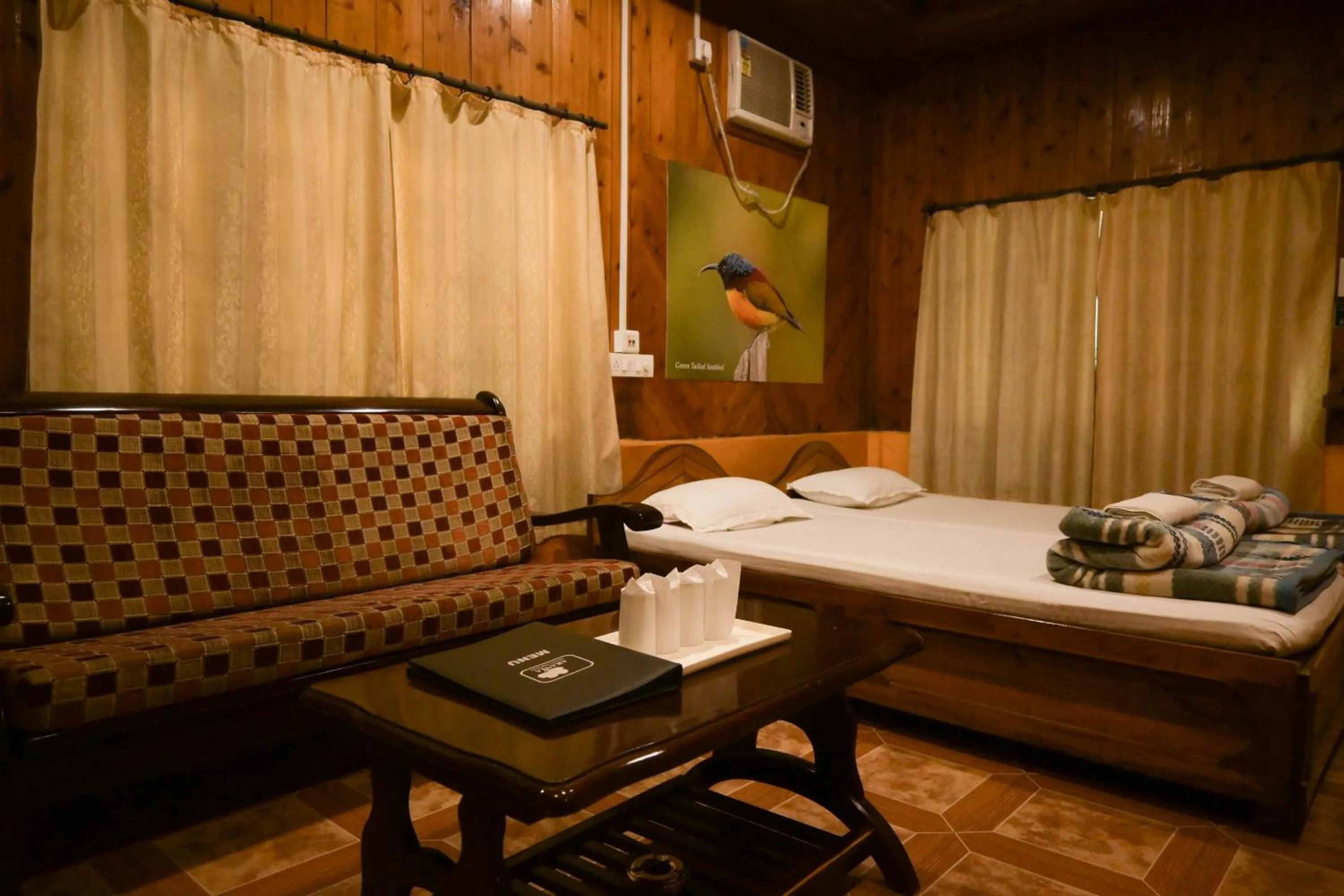 Bed in Aranya Jungle Resorts