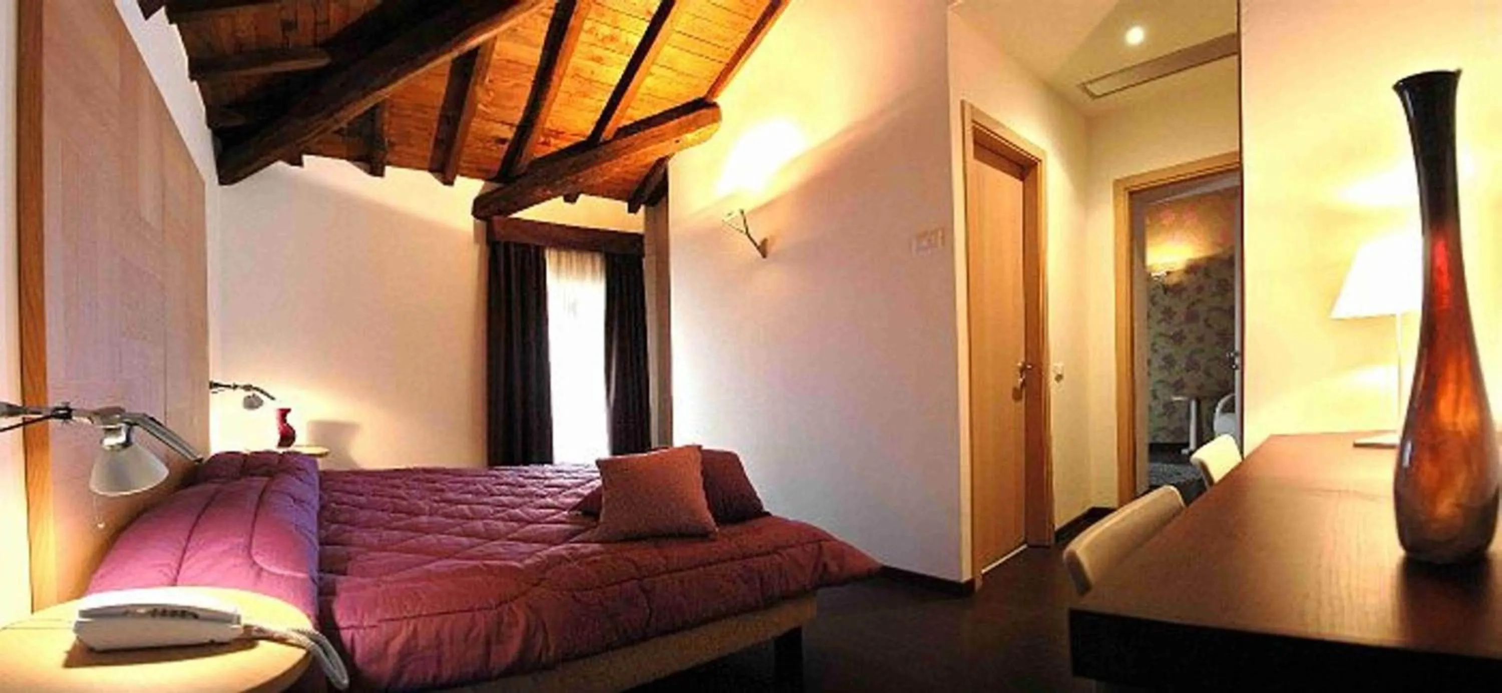 Bed in Relais Villa D'Assio