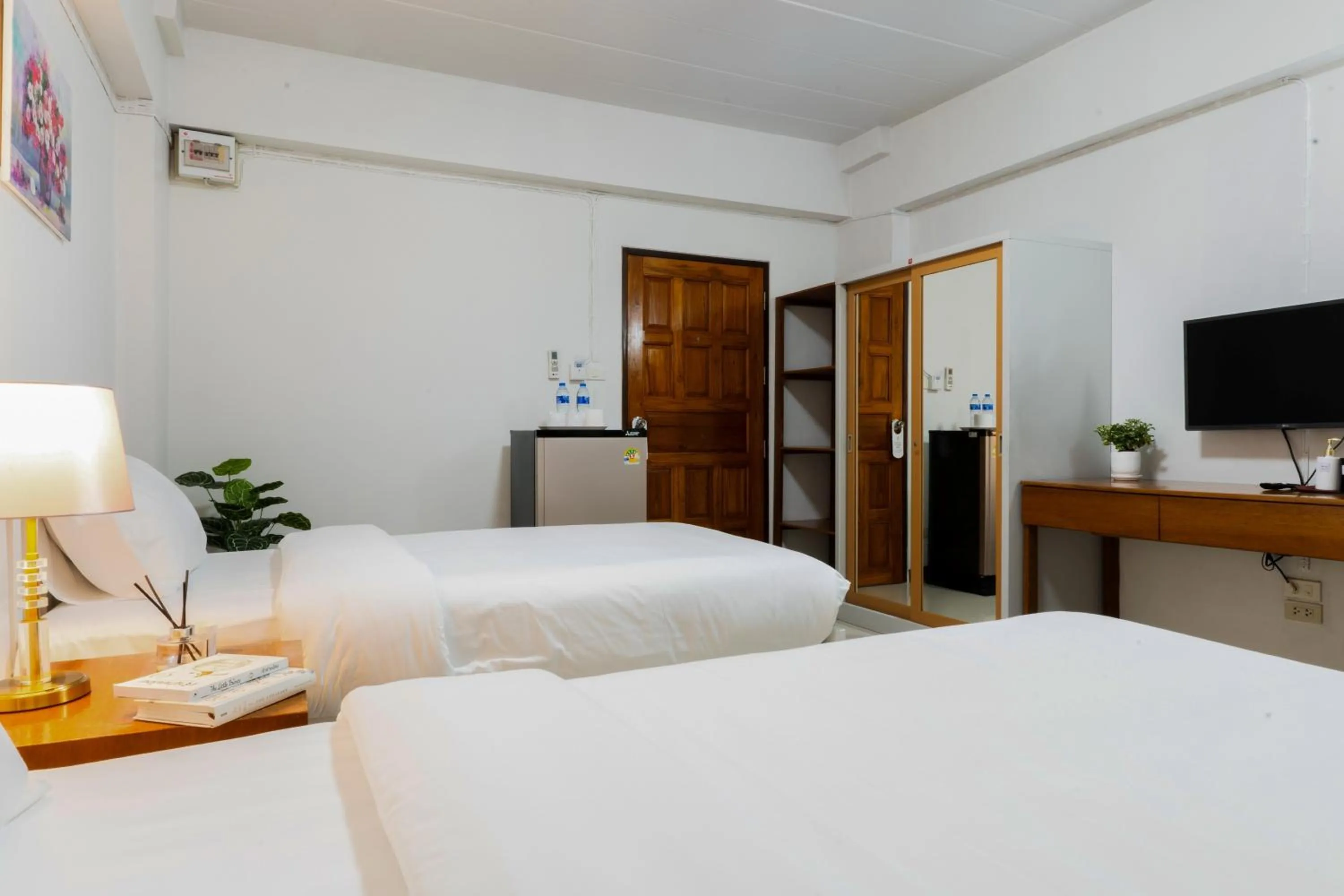 Bed in Nicha Residence Hotel