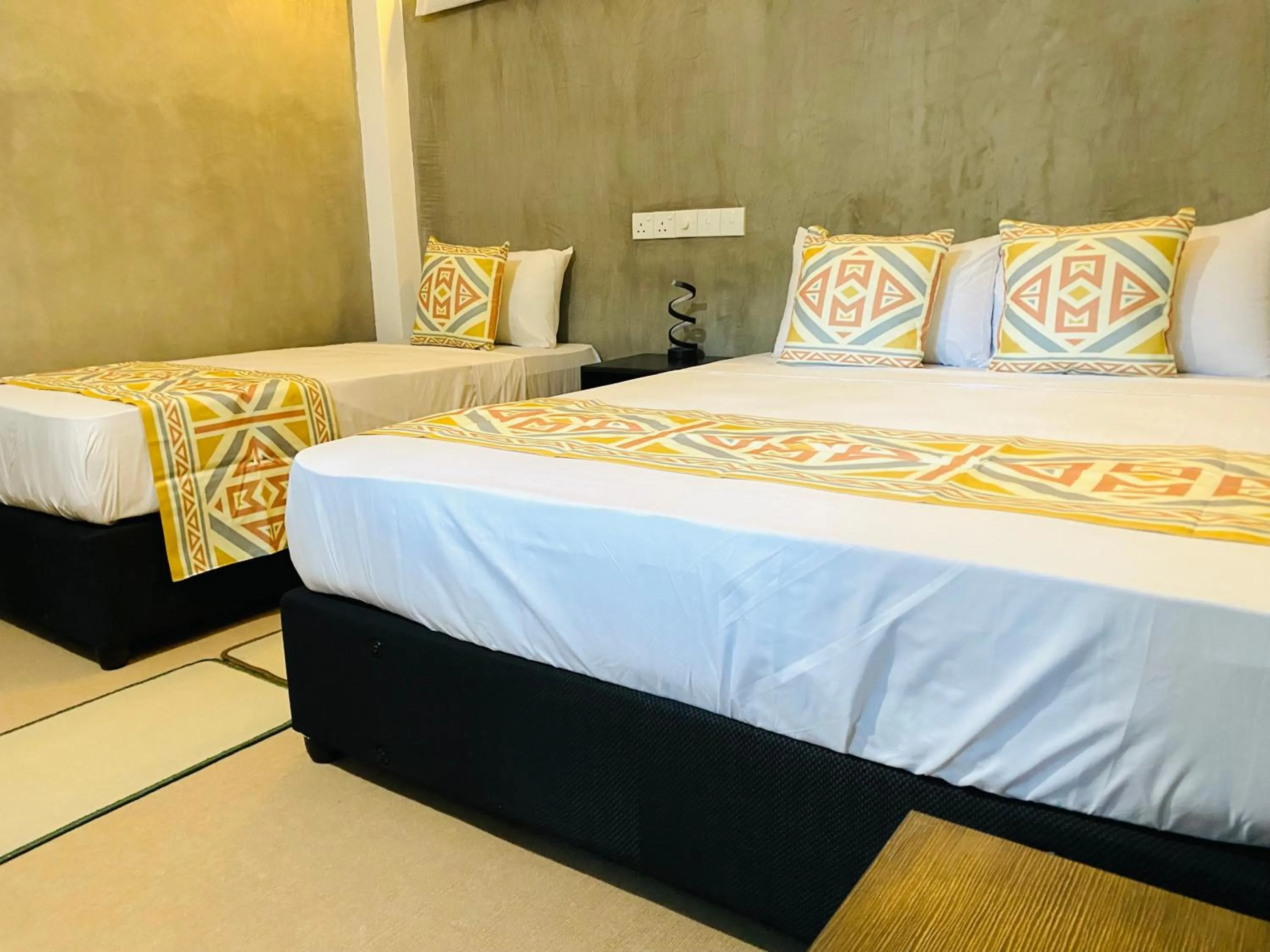 Bed in Coco Palm Villa and Cabanas