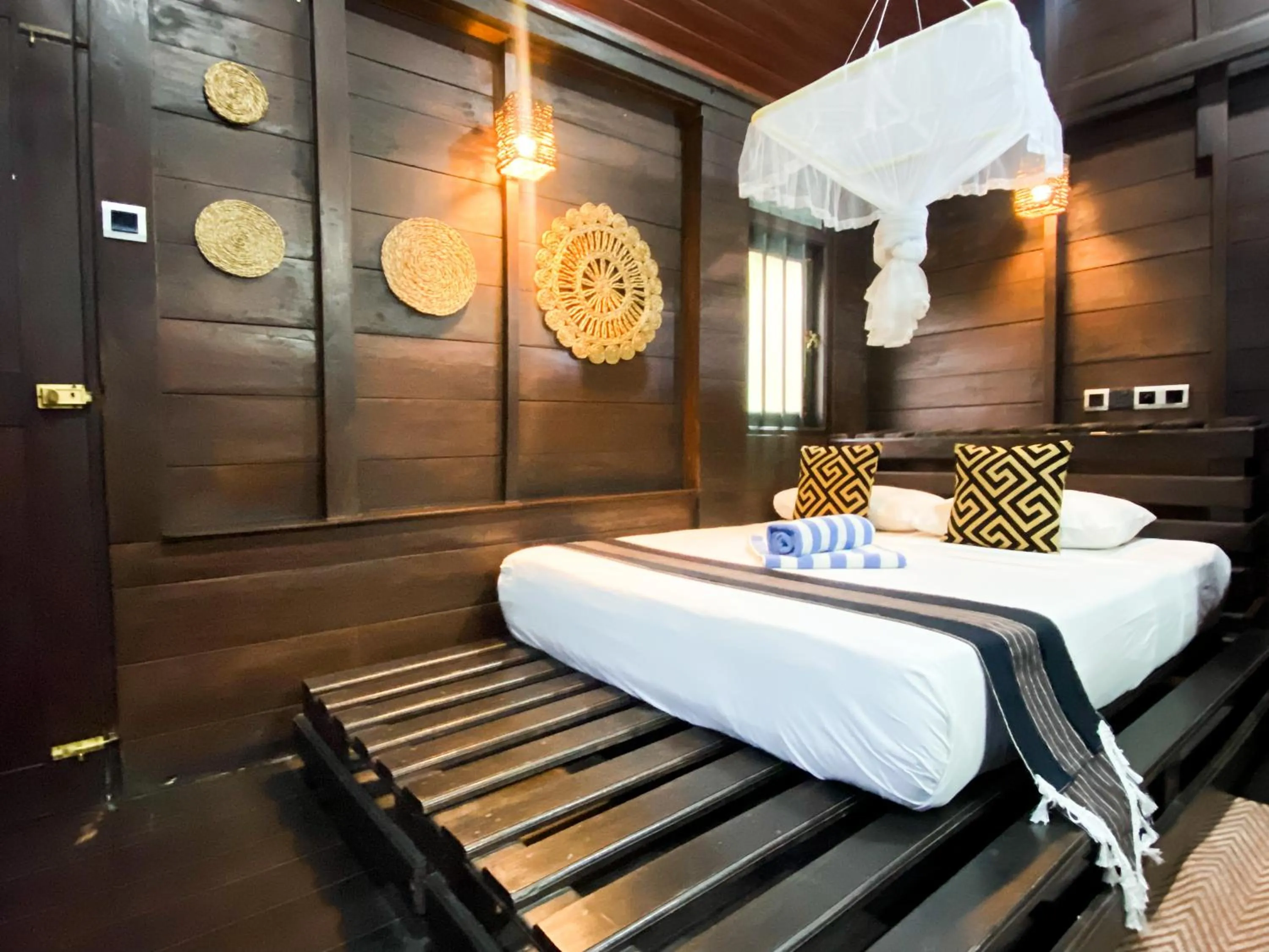 Bed in Coco Palm Villa and Cabanas