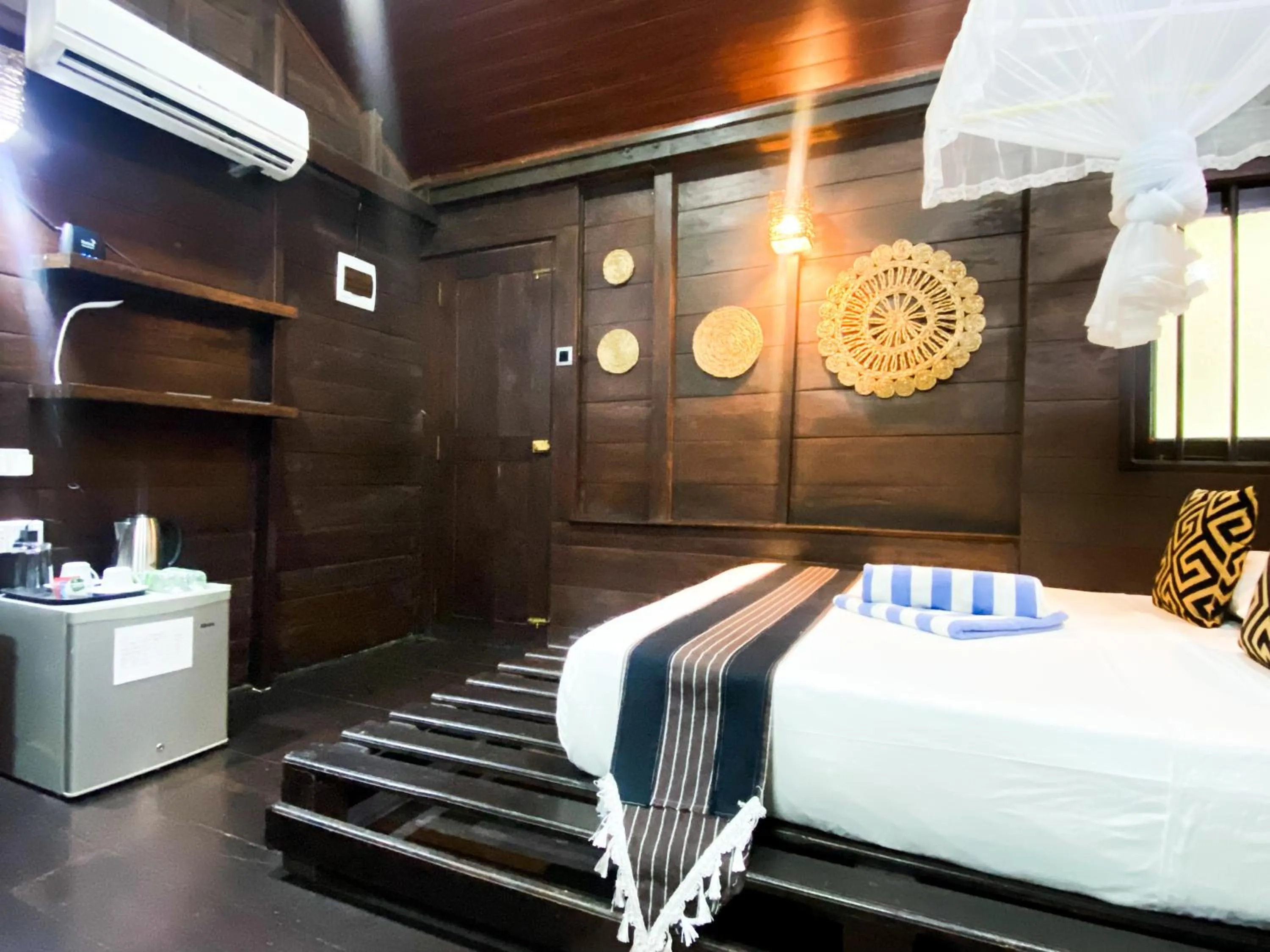 Bed in Coco Palm Villa and Cabanas