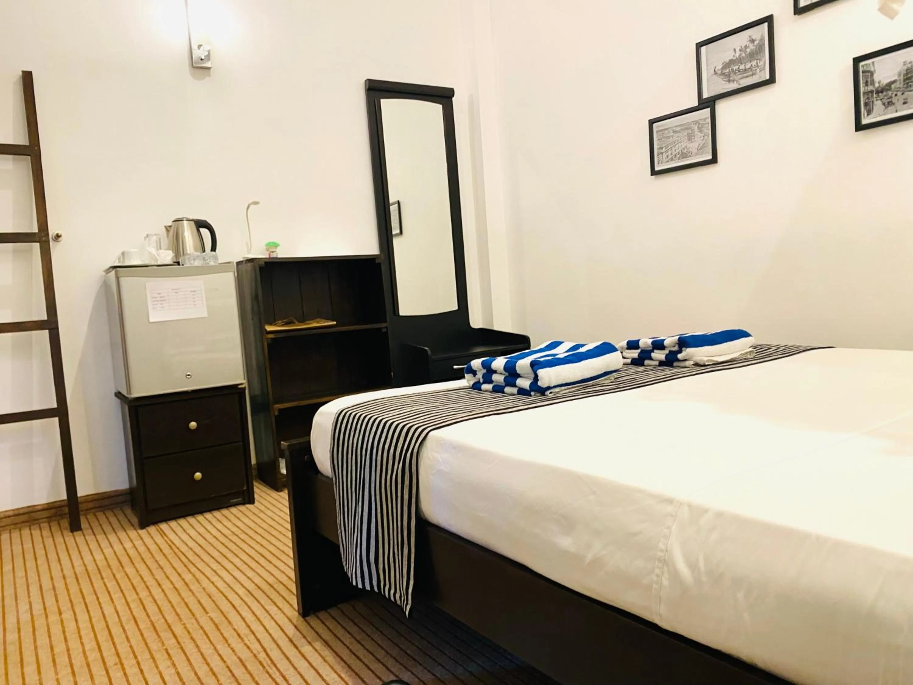 Bed in Coco Palm Villa and Cabanas