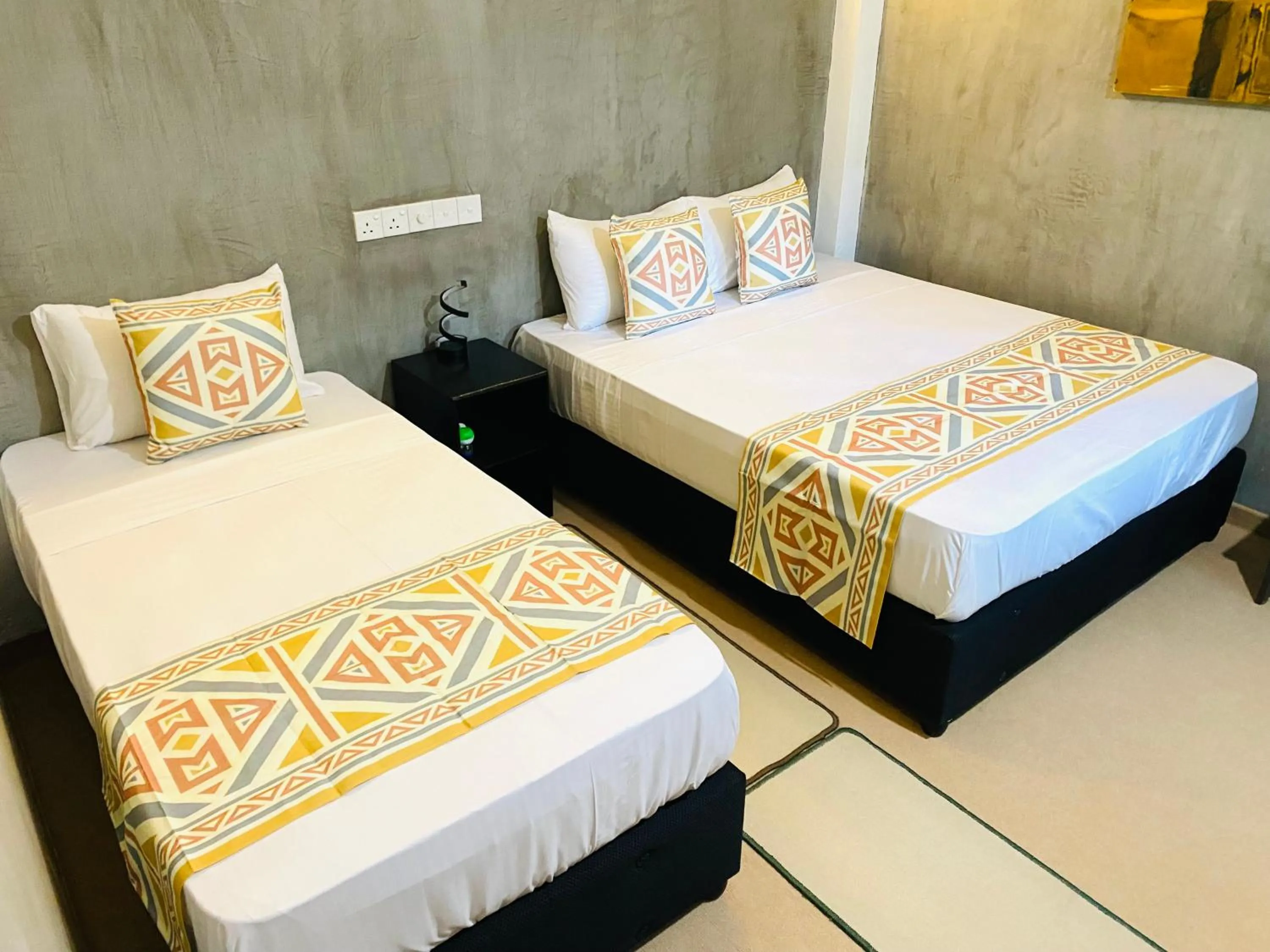 Bed in Coco Palm Villa and Cabanas