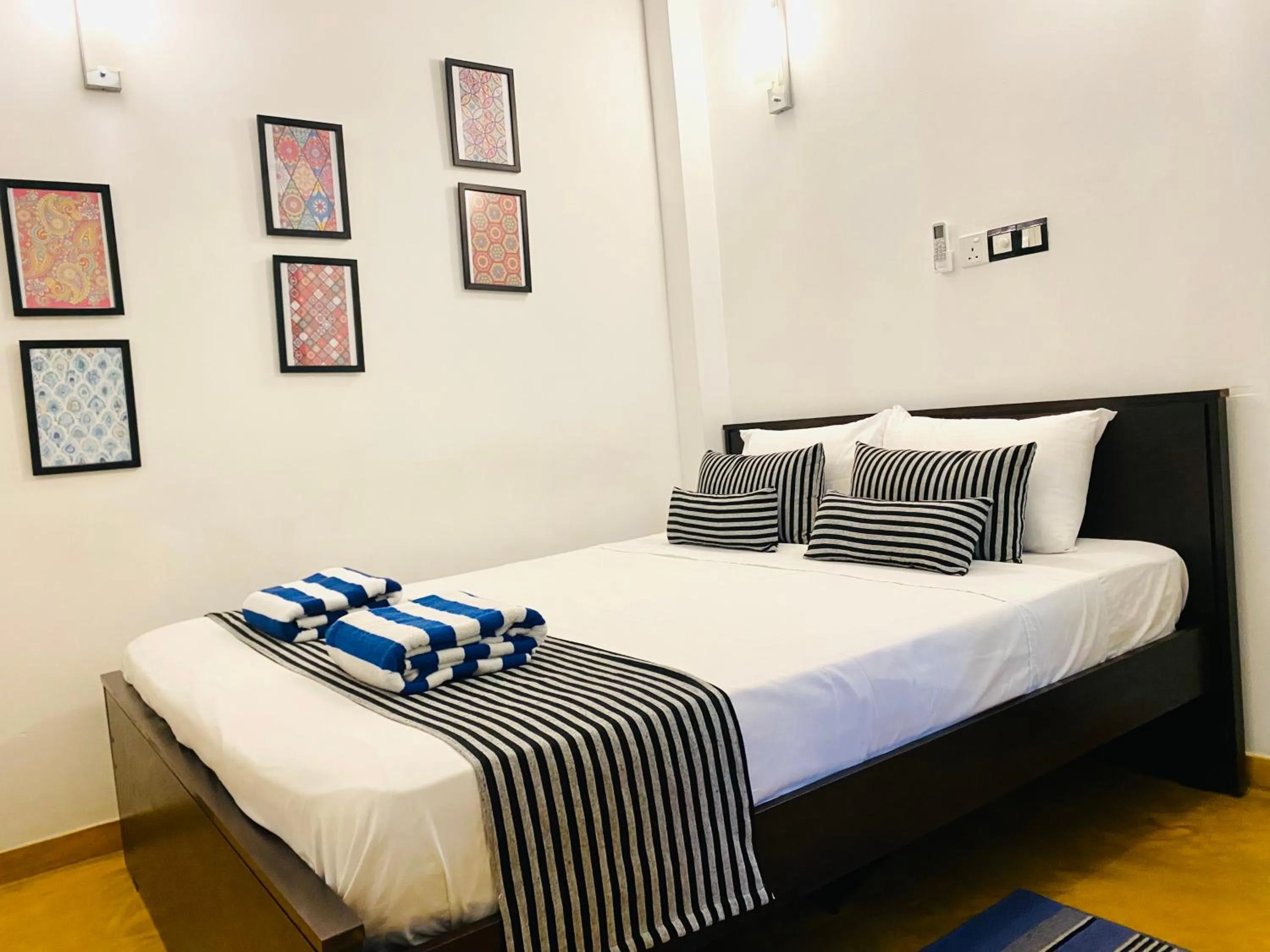 Bed in Coco Palm Villa and Cabanas