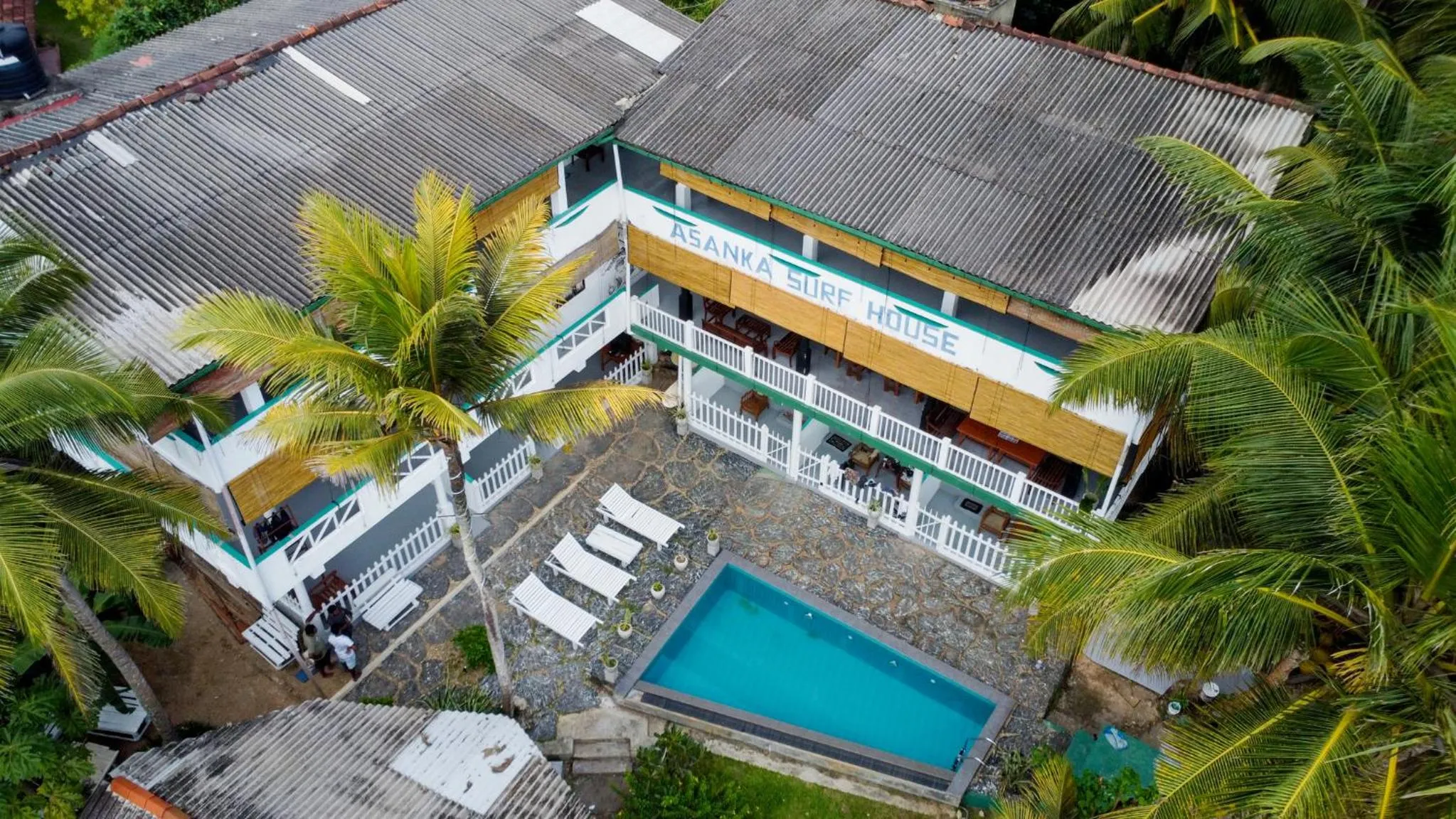 Property building in Asanka Surf House & Restaurant with pool