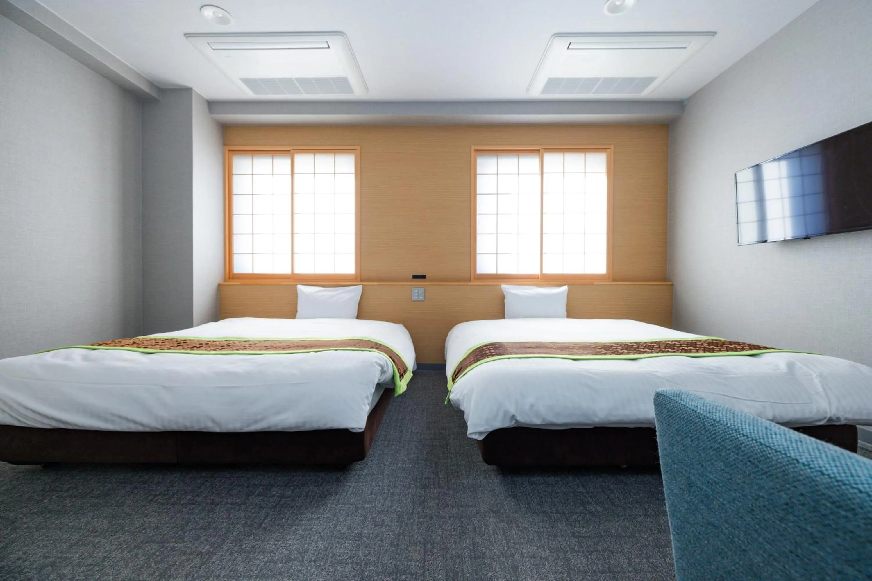 Bed in Hotel Takasago