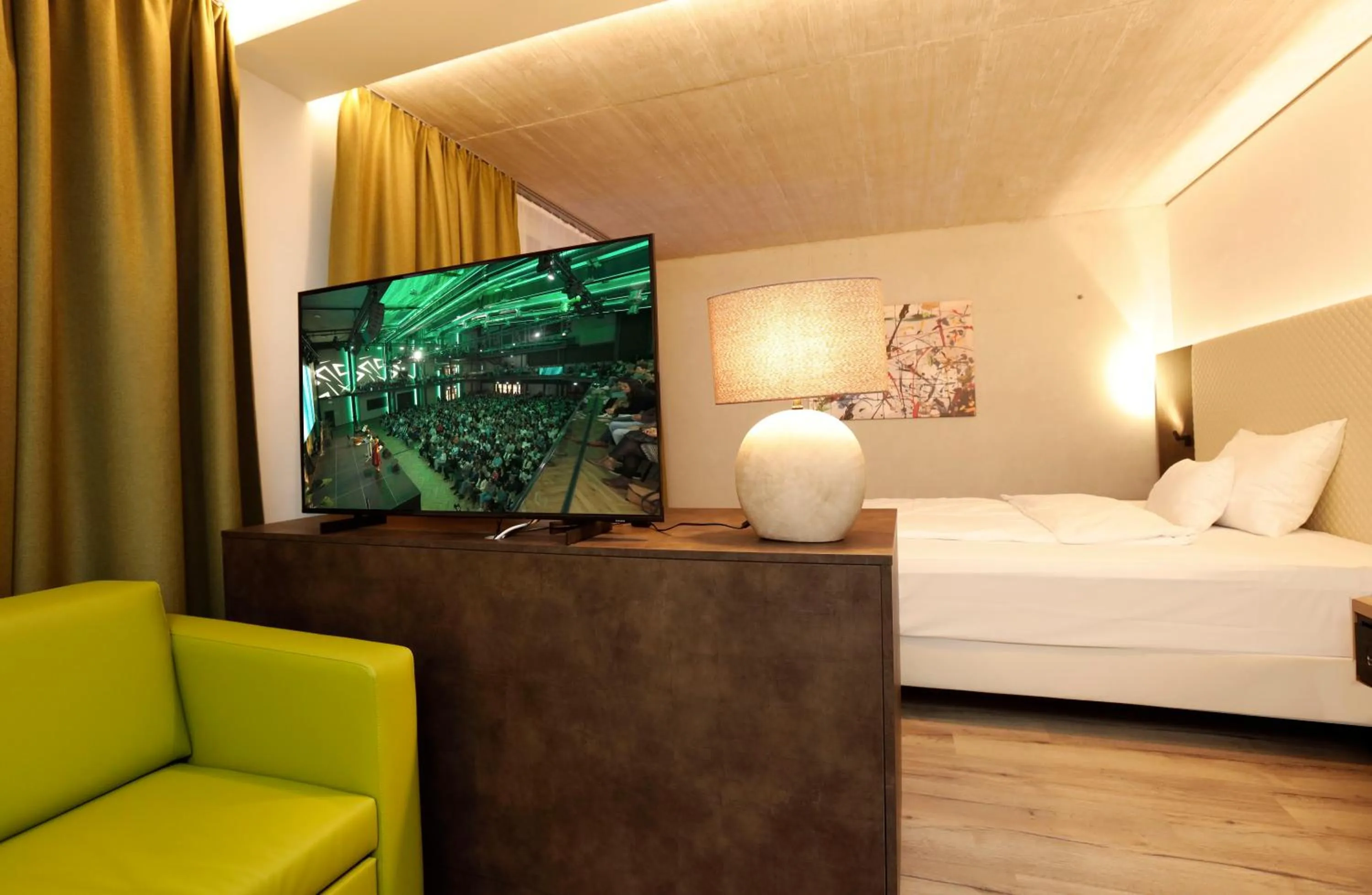 Living room, Bed in Hotel im Zentrum für Visionen