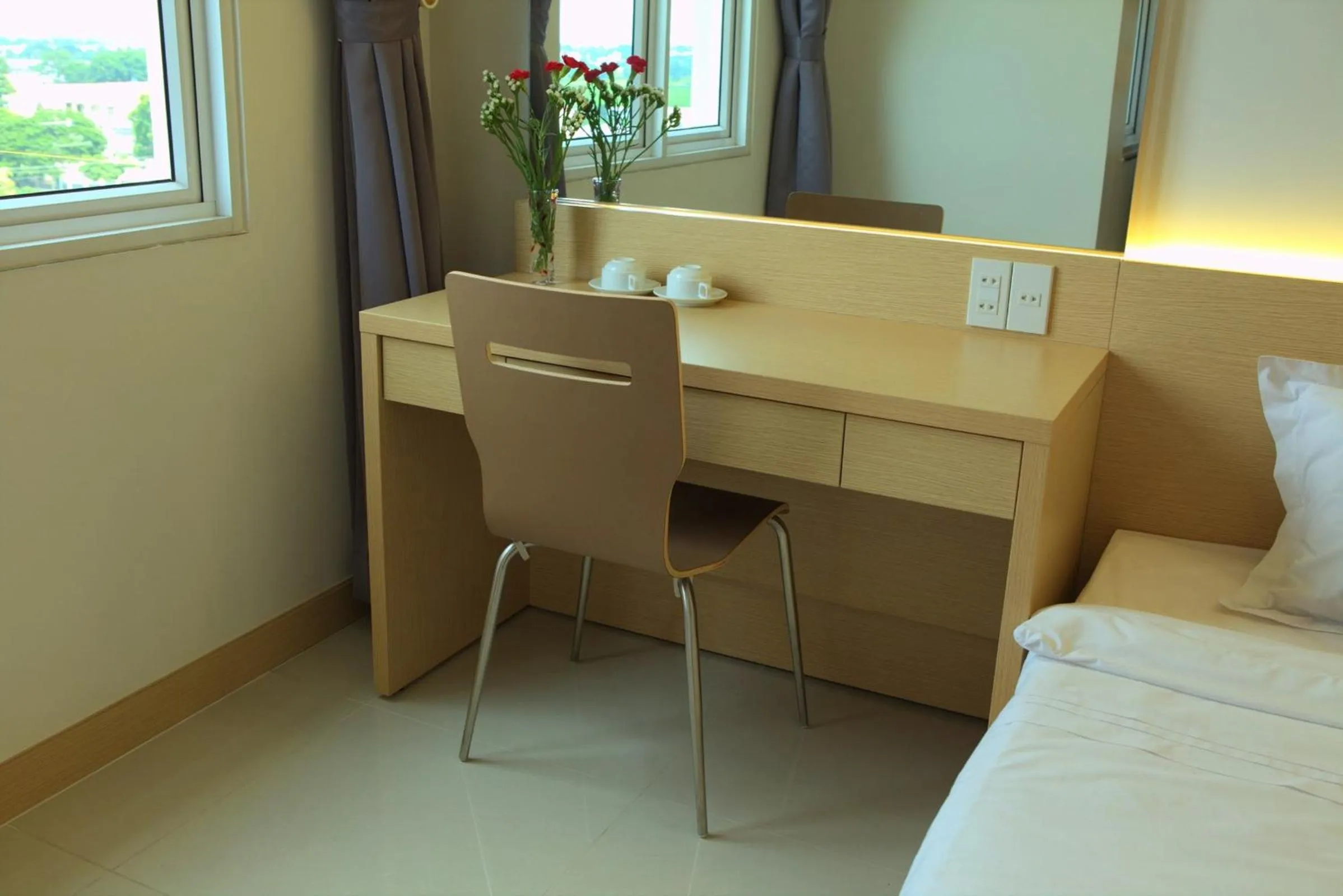 Seating area, Bed in Hung Cuong Hotel