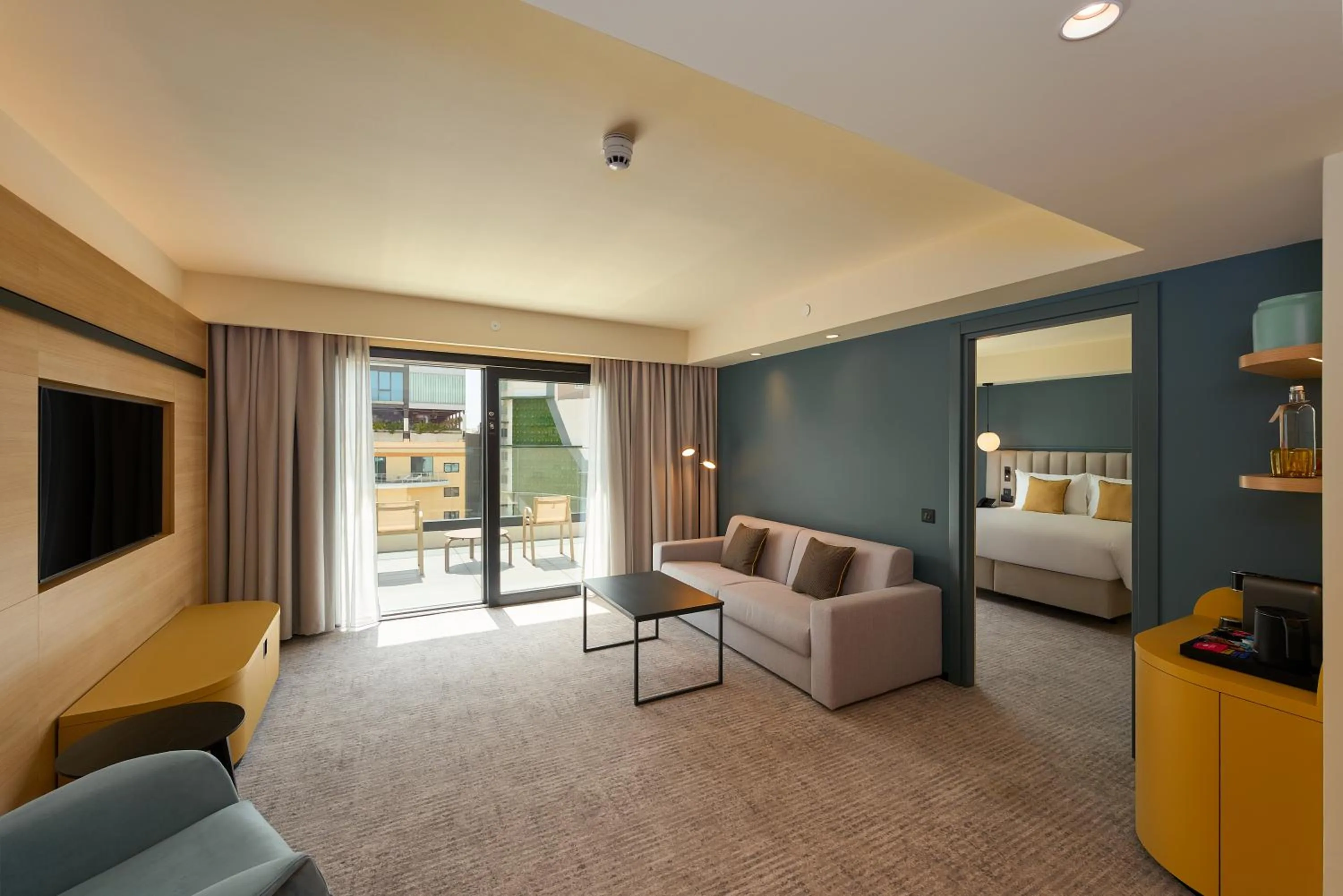 Living room, Bed in voco Malta by IHG