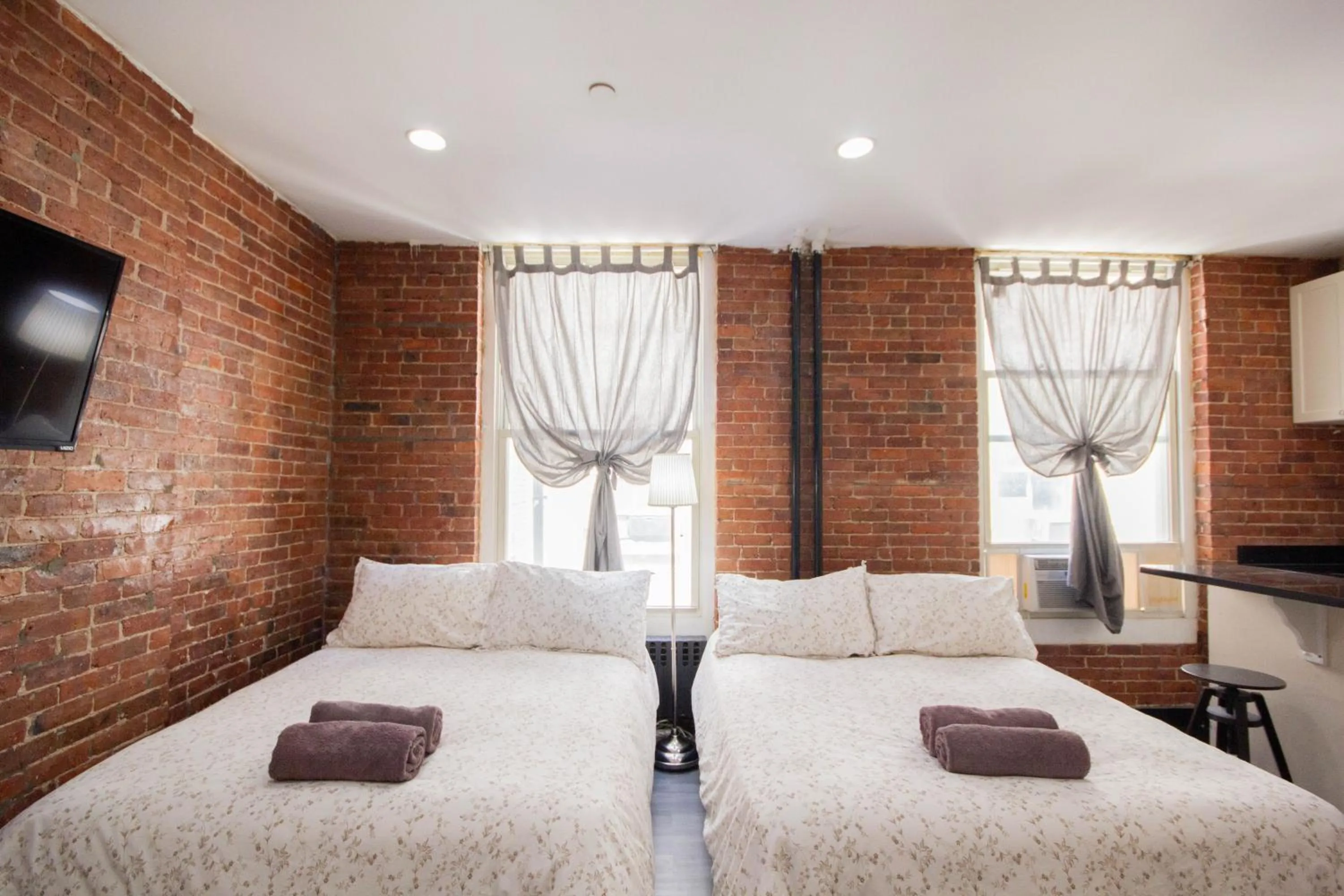 Bedroom in Studio Plus - Cozy Apartments