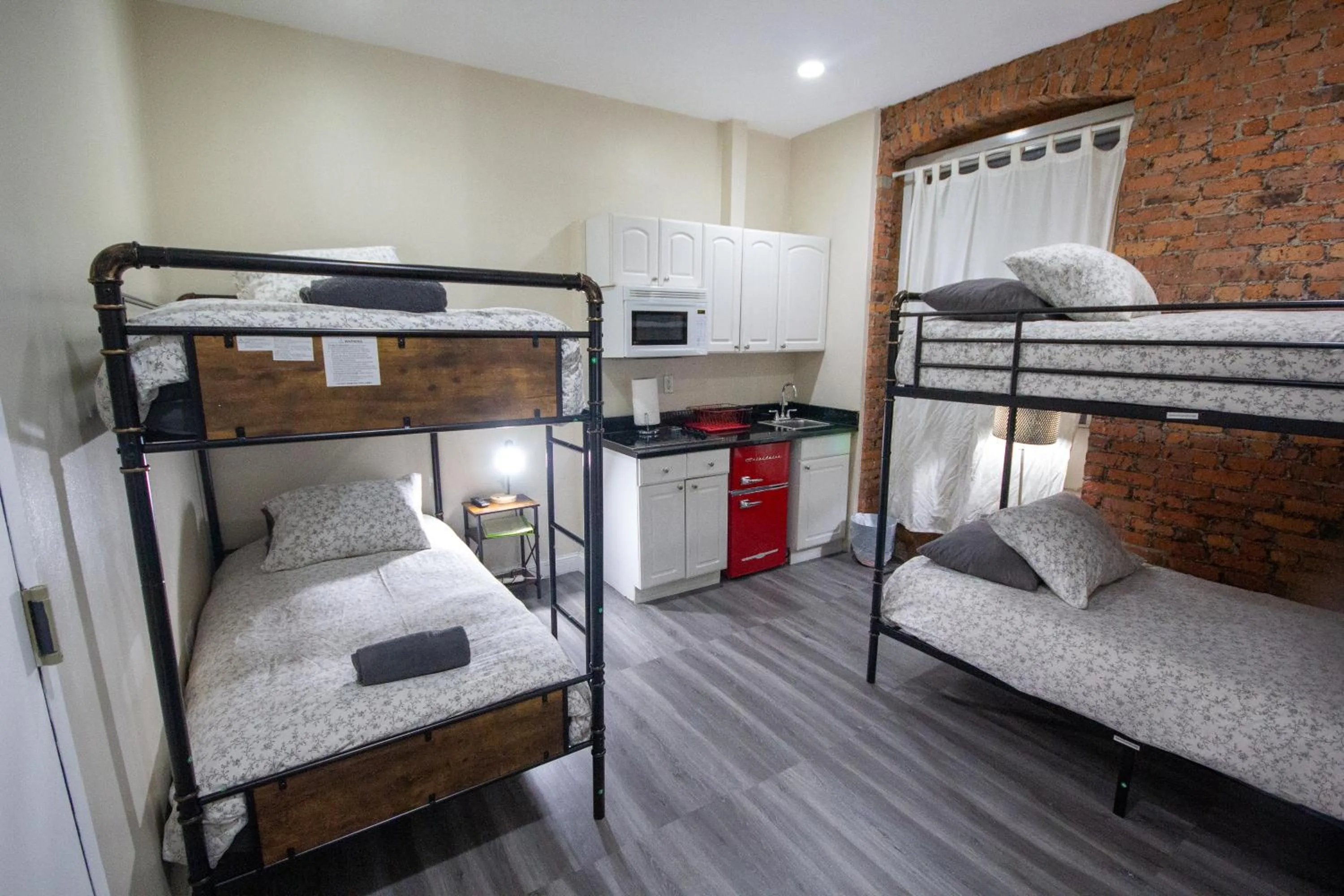 Bed in Studio Plus - Cozy Apartments