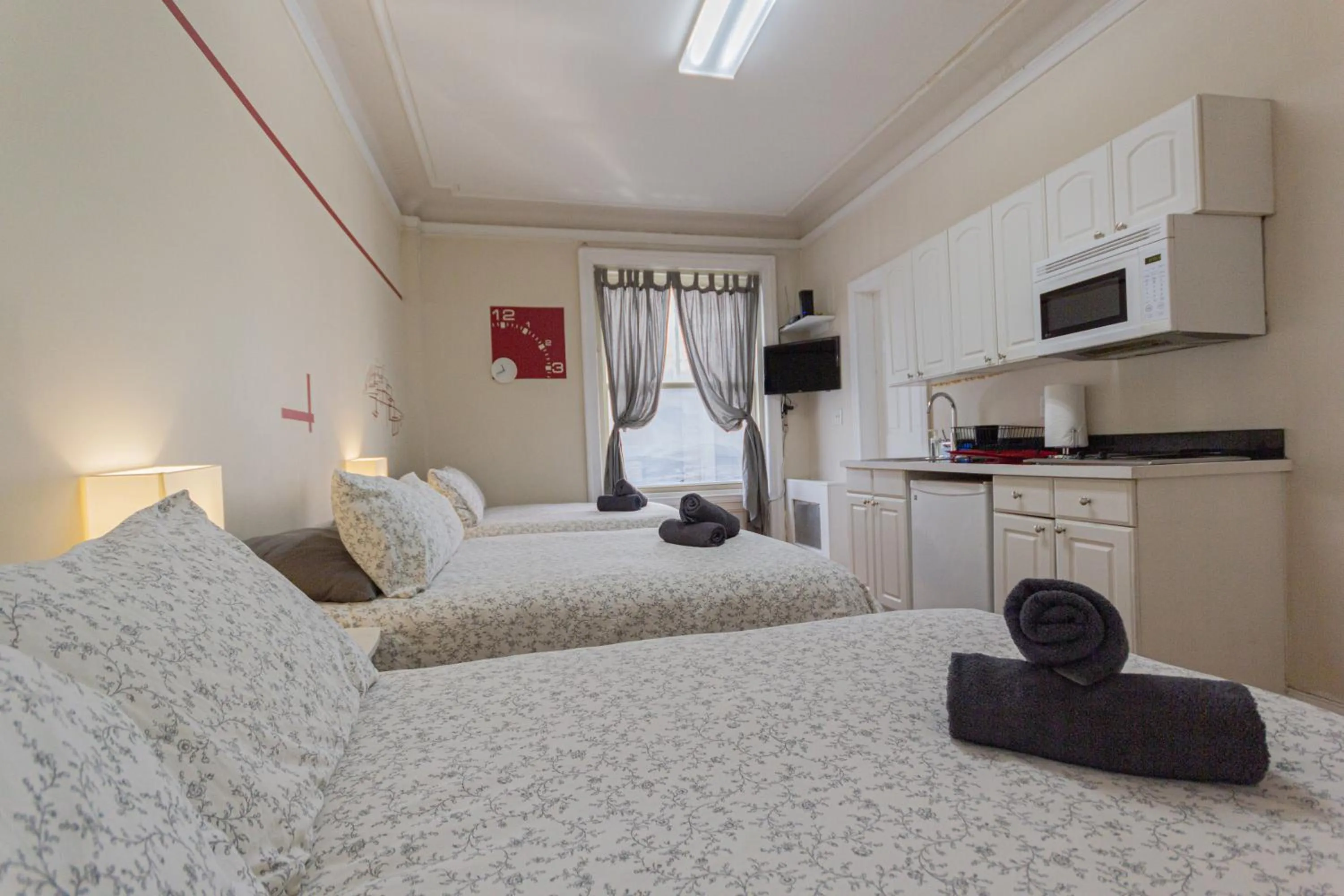 Bed in Studio Plus - Cozy Apartments