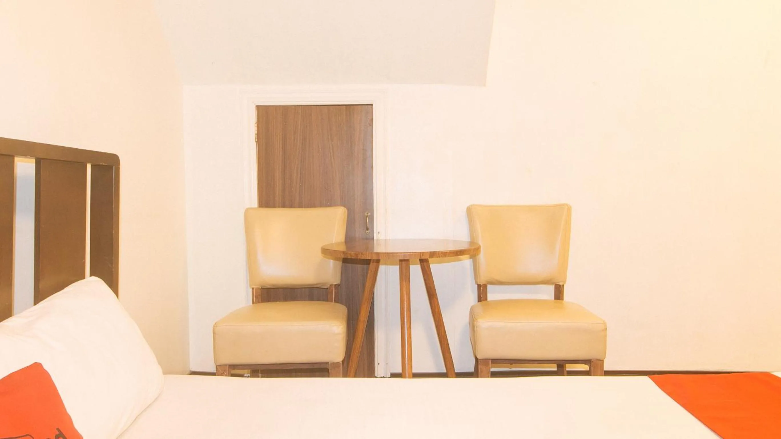 Seating area in RedDoorz at Emperor Manila Boutique Hotel