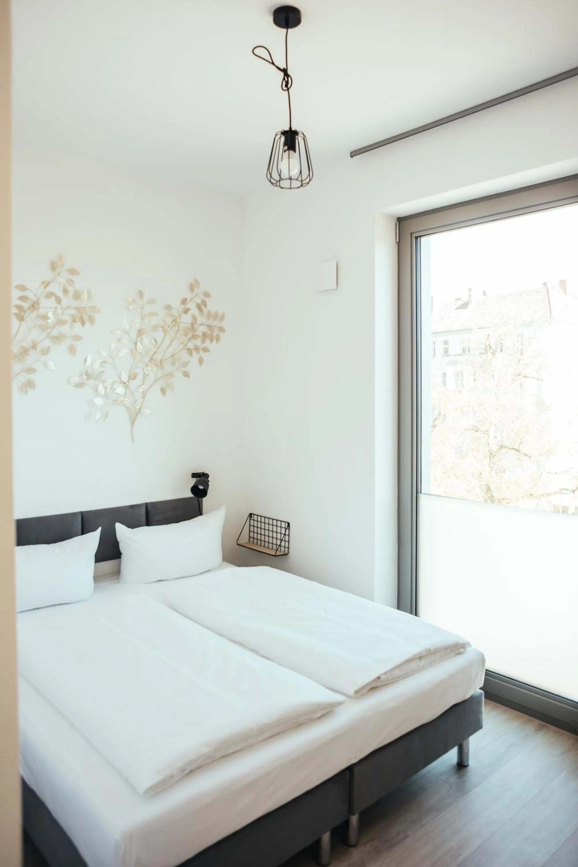 Bed in The Rix Studios & Suites