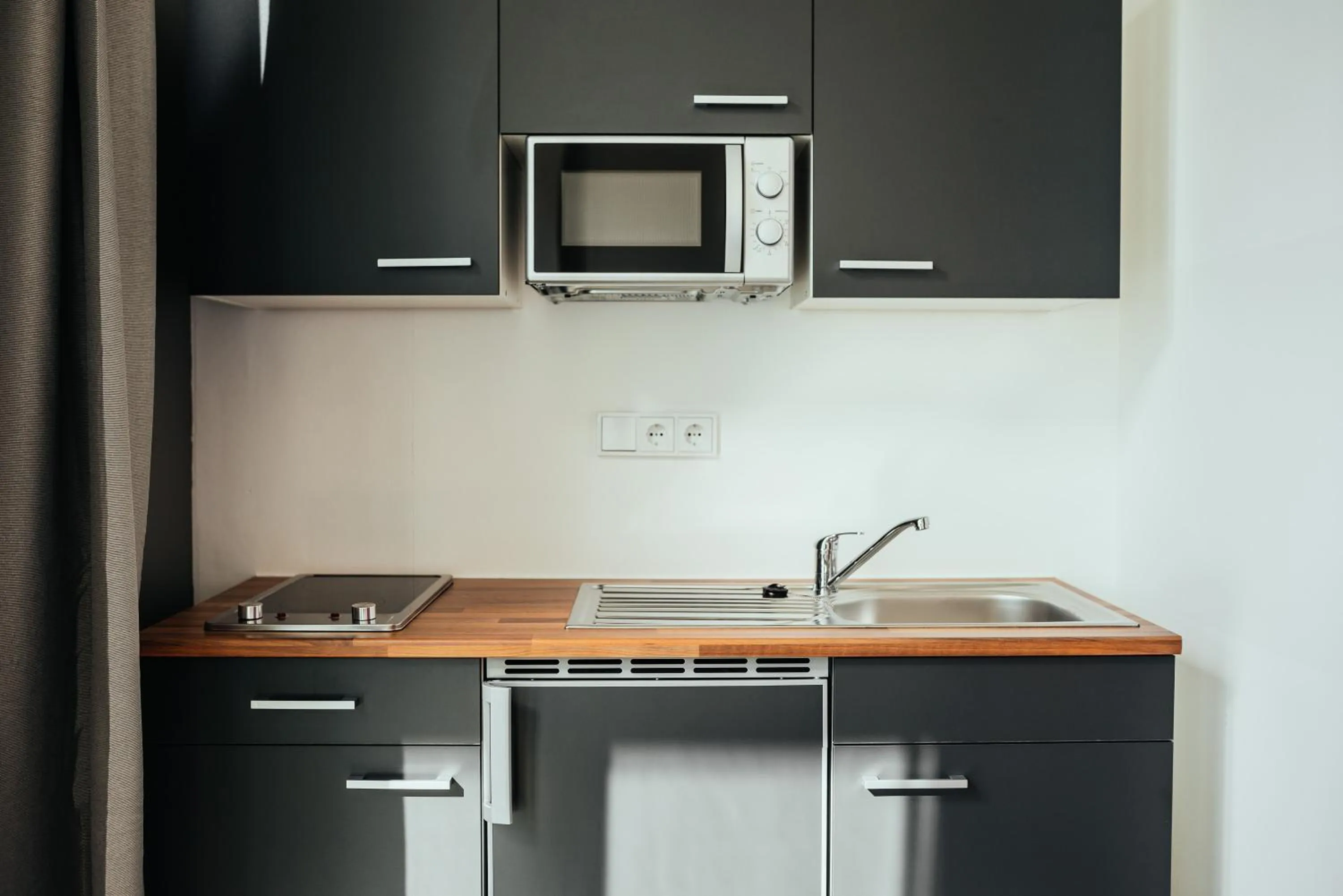 Kitchen or kitchenette in The Rix Studios & Suites