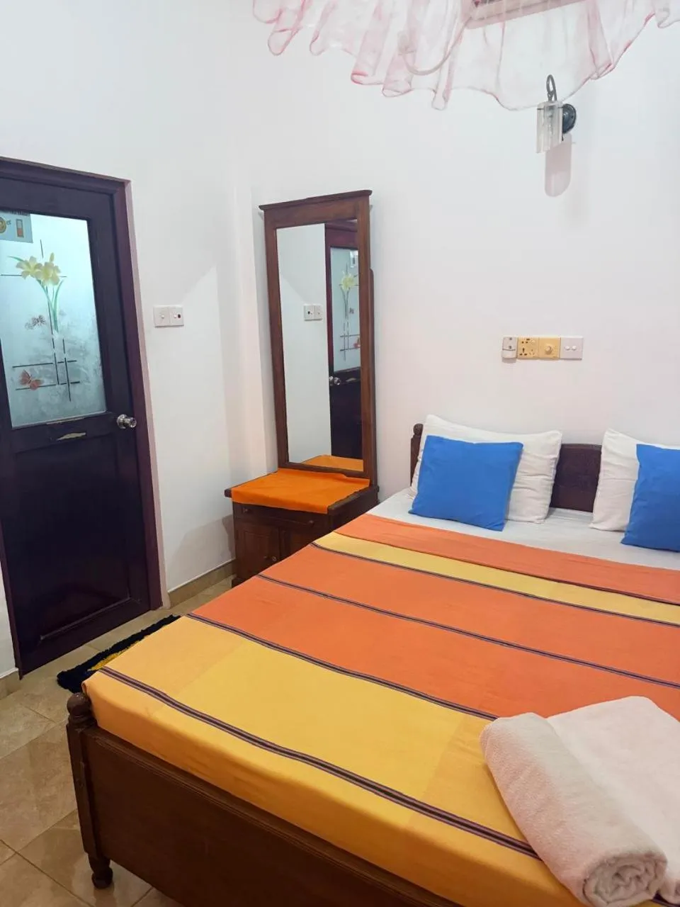 Bed in Pearl Deluna Resort Mirissa