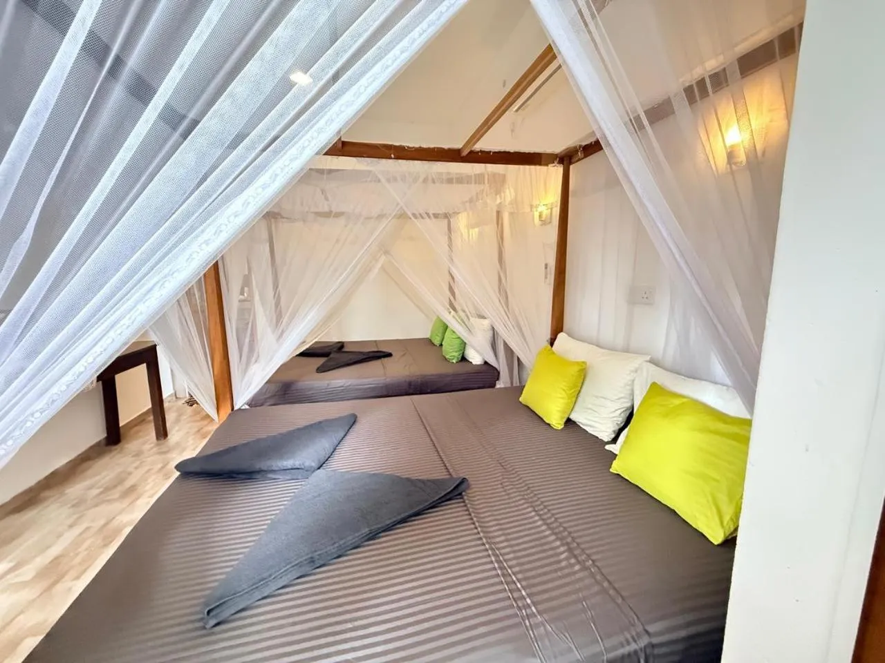 Bed in Pearl Deluna Resort Mirissa