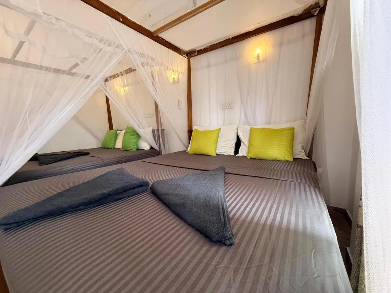 Bed in Pearl Deluna Resort Mirissa