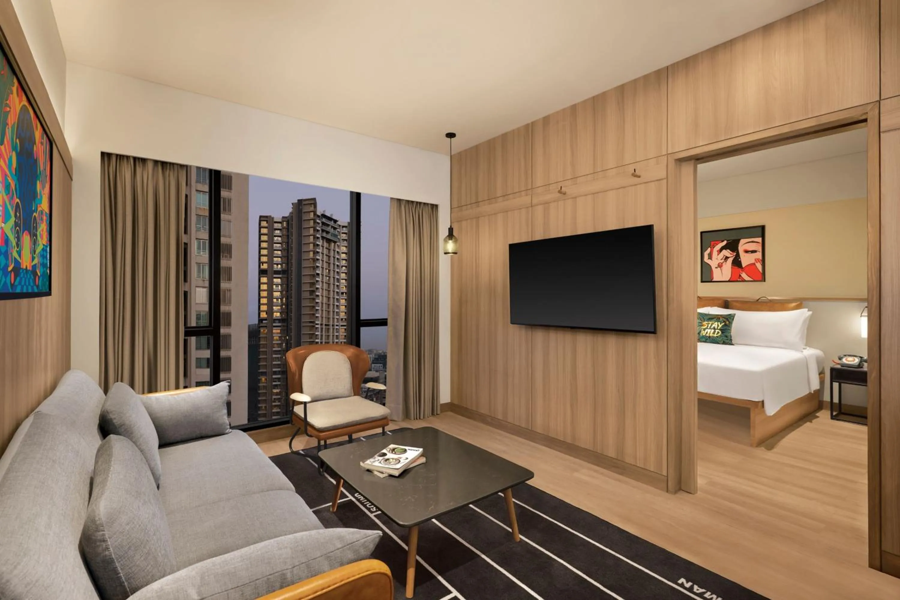 Living room, Bed in Moxy Mumbai Andheri West