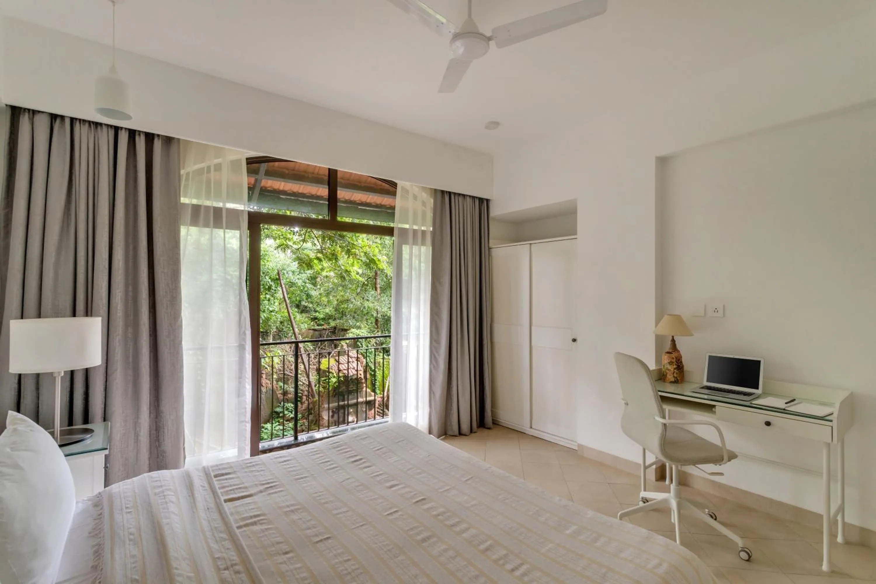 Bedroom, Bed in D'Retreat 1BHK Apartment by tisyastays