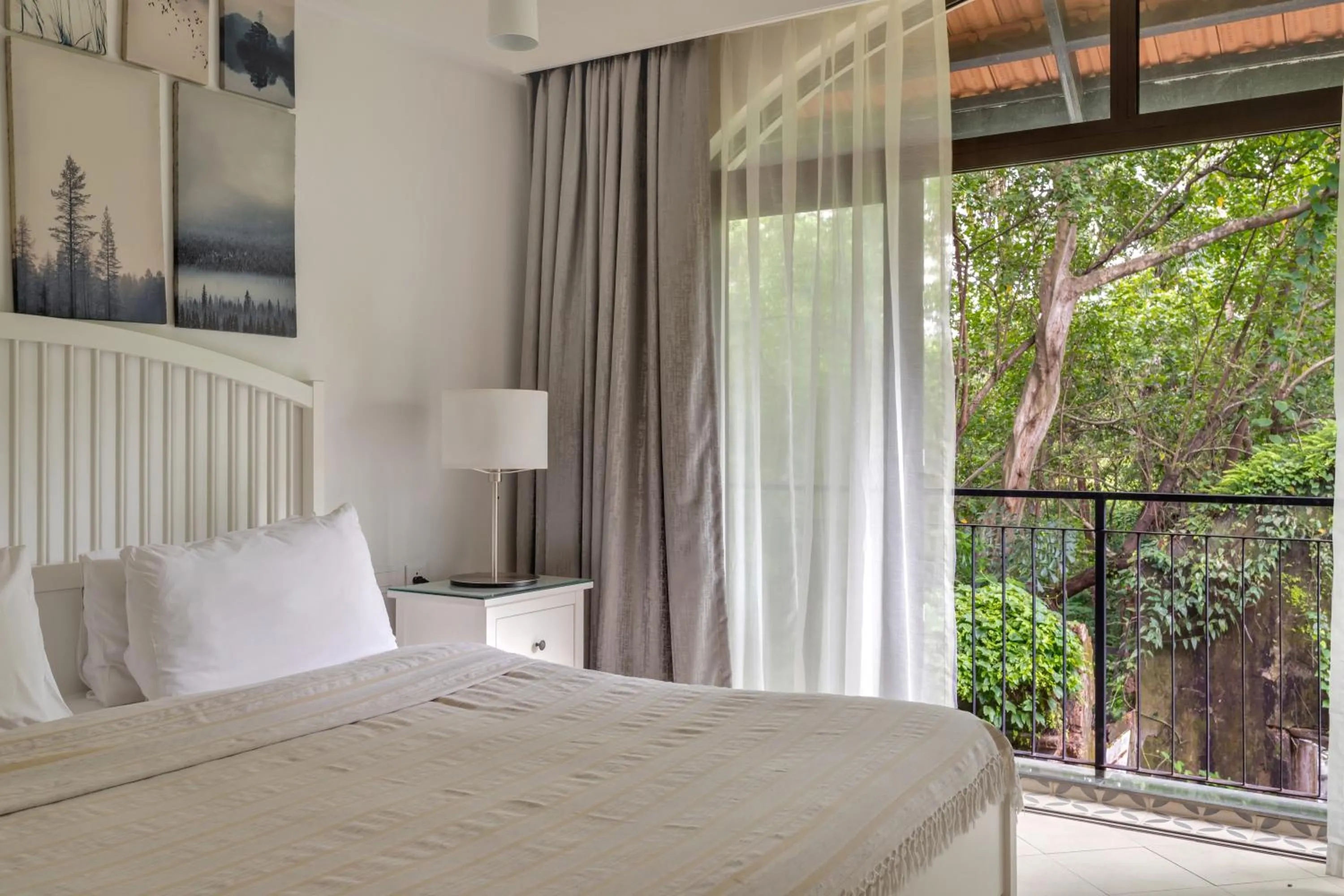 Bedroom, Bed in D'Retreat 1BHK Apartment by tisyastays