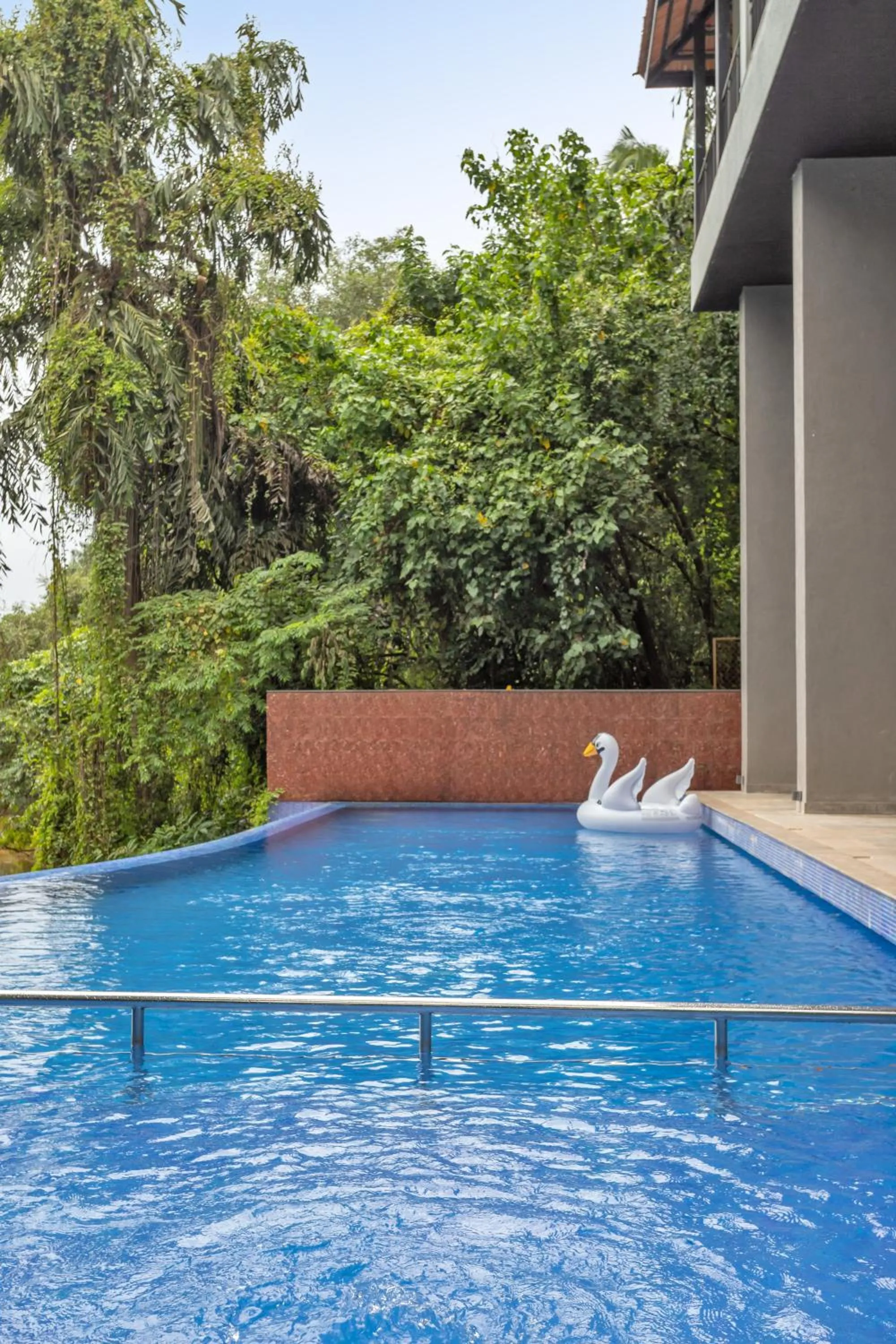 Swimming pool in D'Retreat 1BHK Apartment by tisyastays