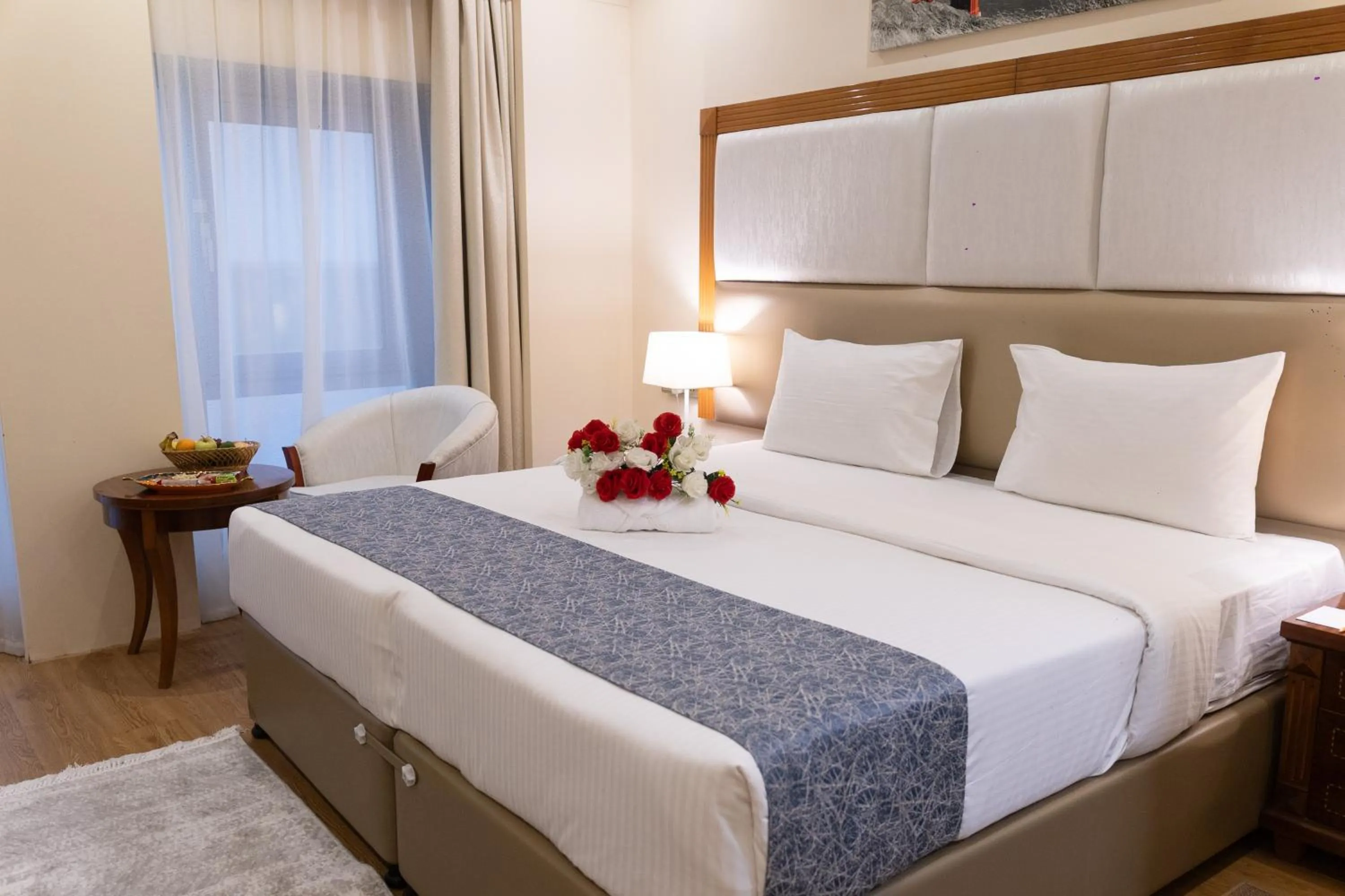 Bed in Vendome Plaza Hotel