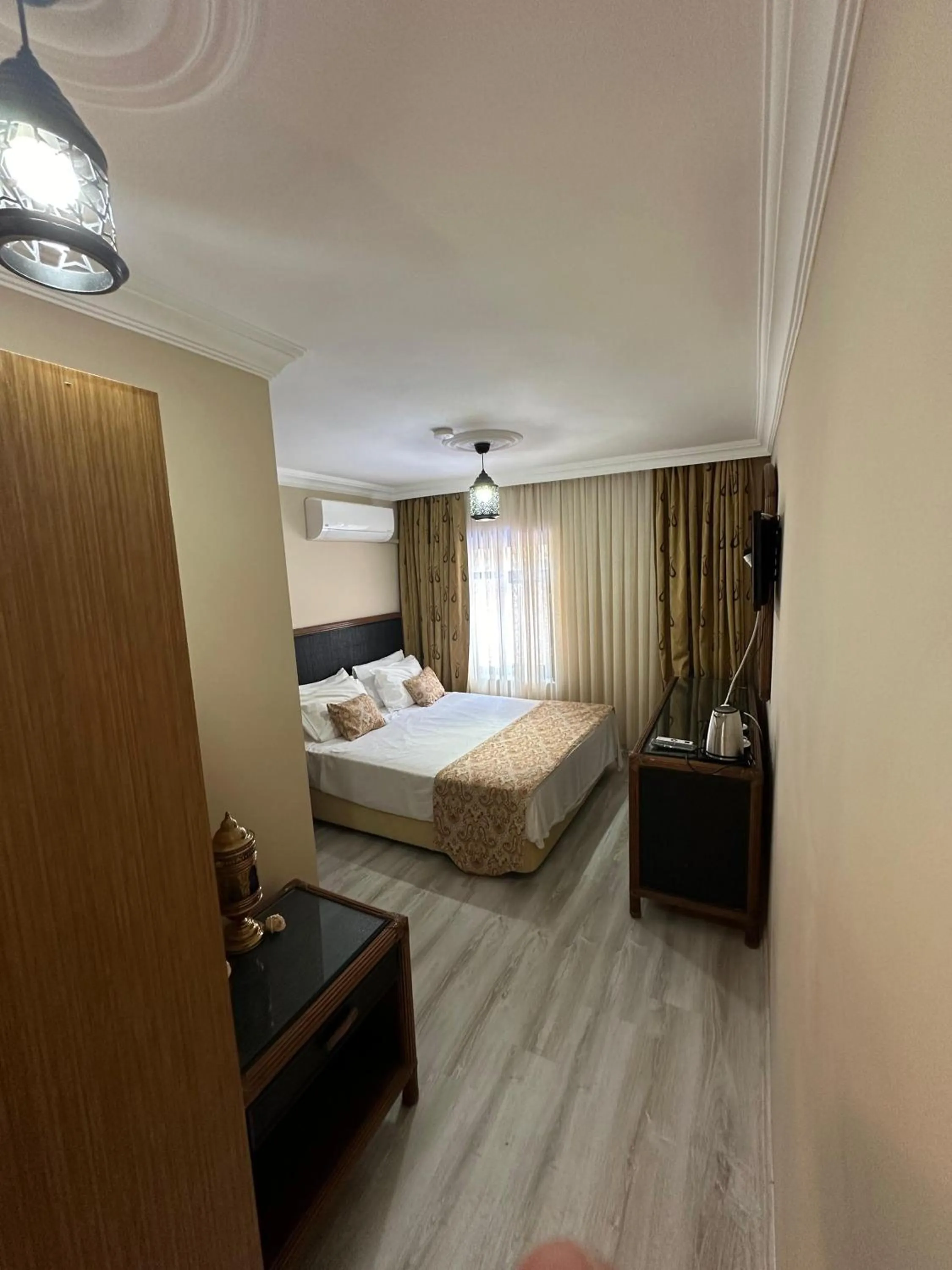 Bed in Loost Town Inn Hotel