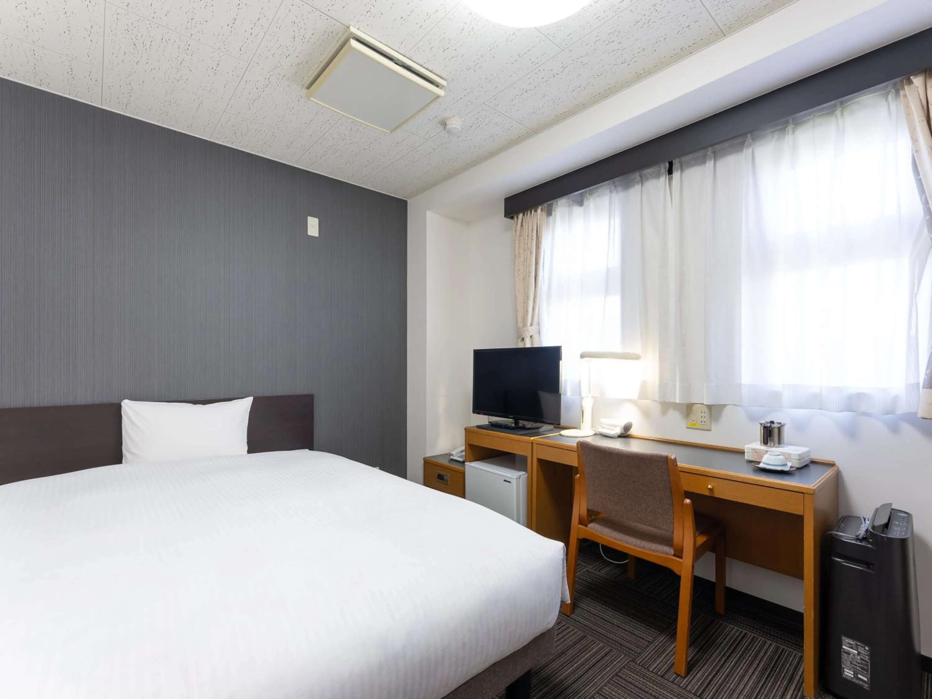 Bed in Noshiro Town Hotel Minami