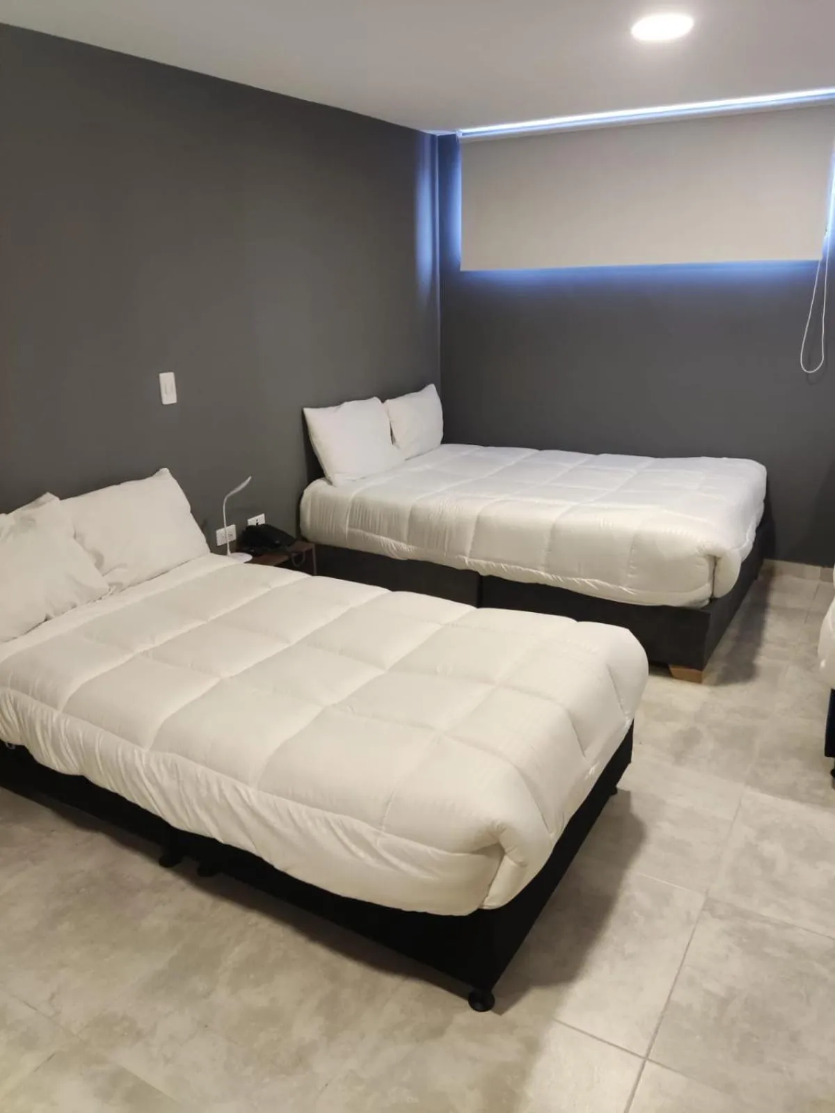 Bed in Xliving Host and Rooms