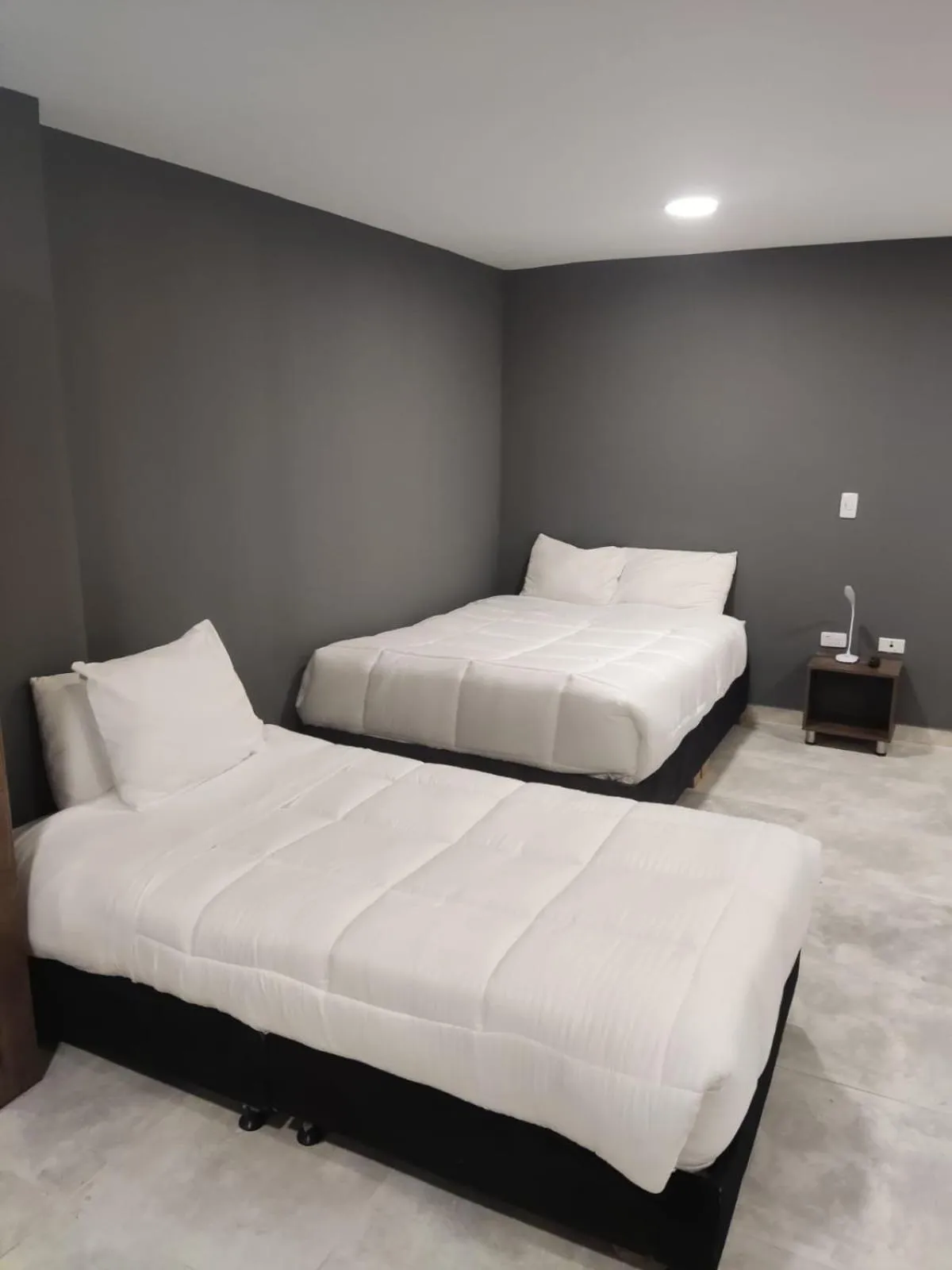 Bed in Xliving Host and Rooms