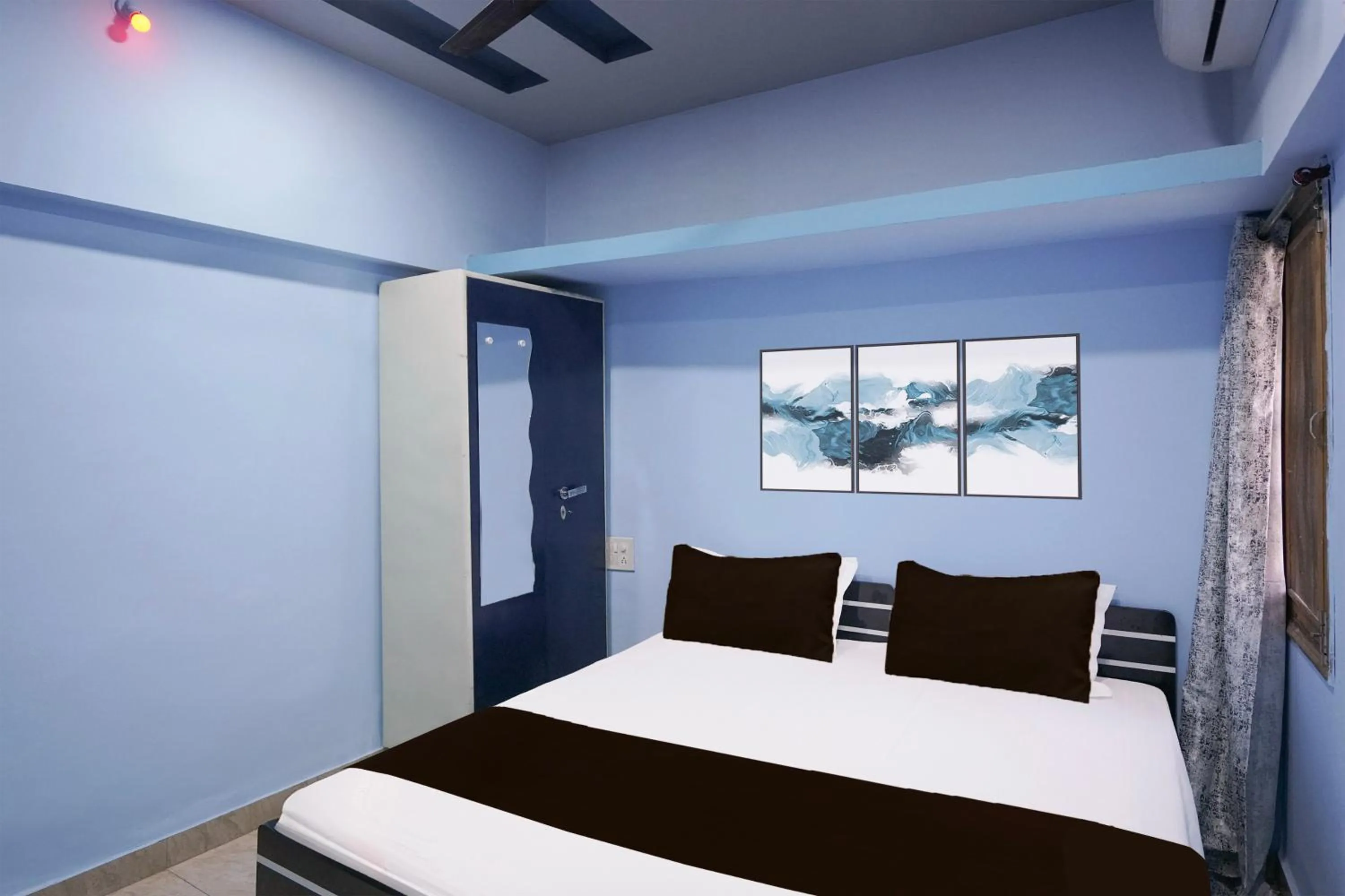 Bedroom in Hotel O Happy Hotel